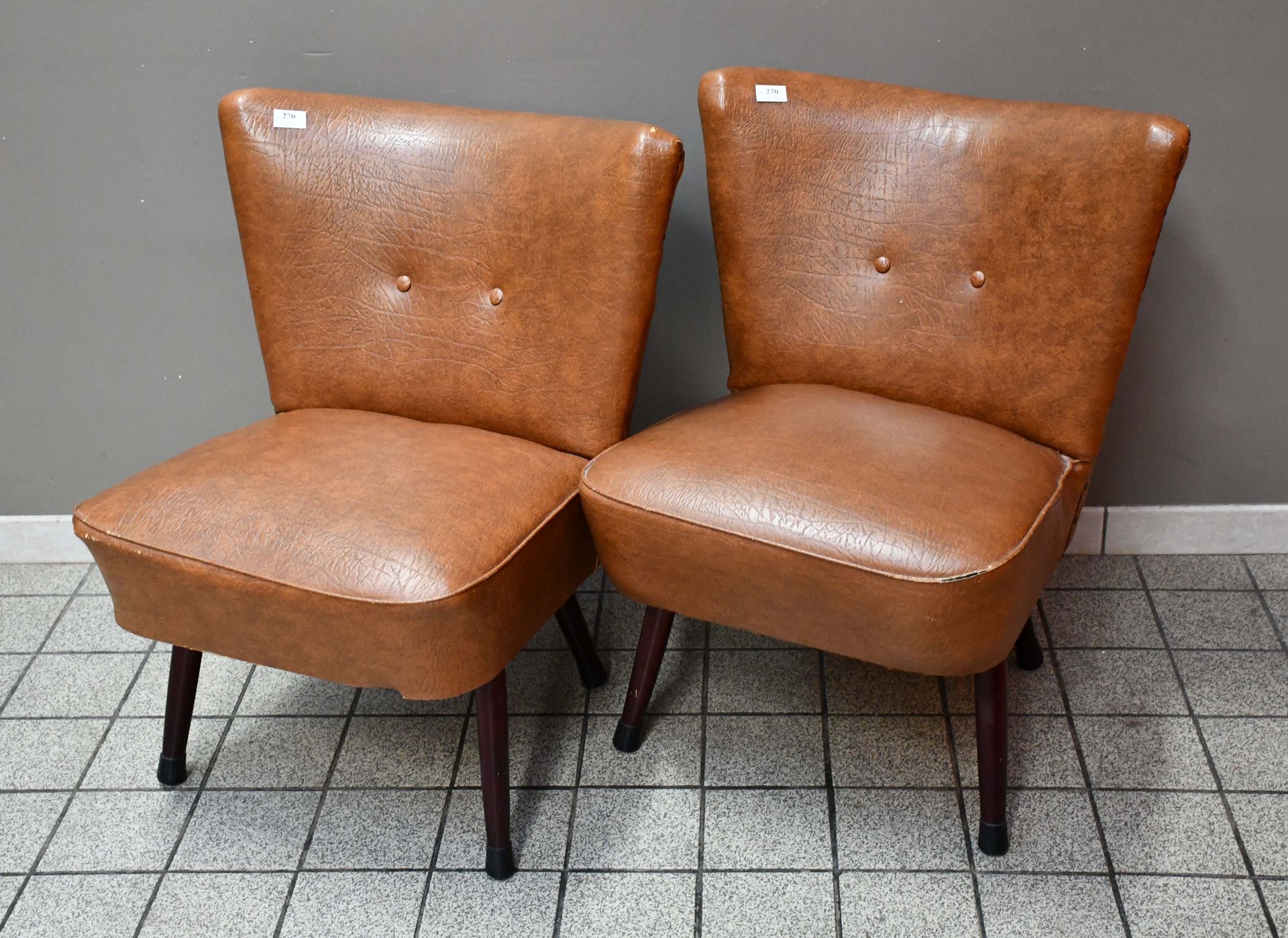 Null Pair of "cocktail" armchairs upholstered in brown skai