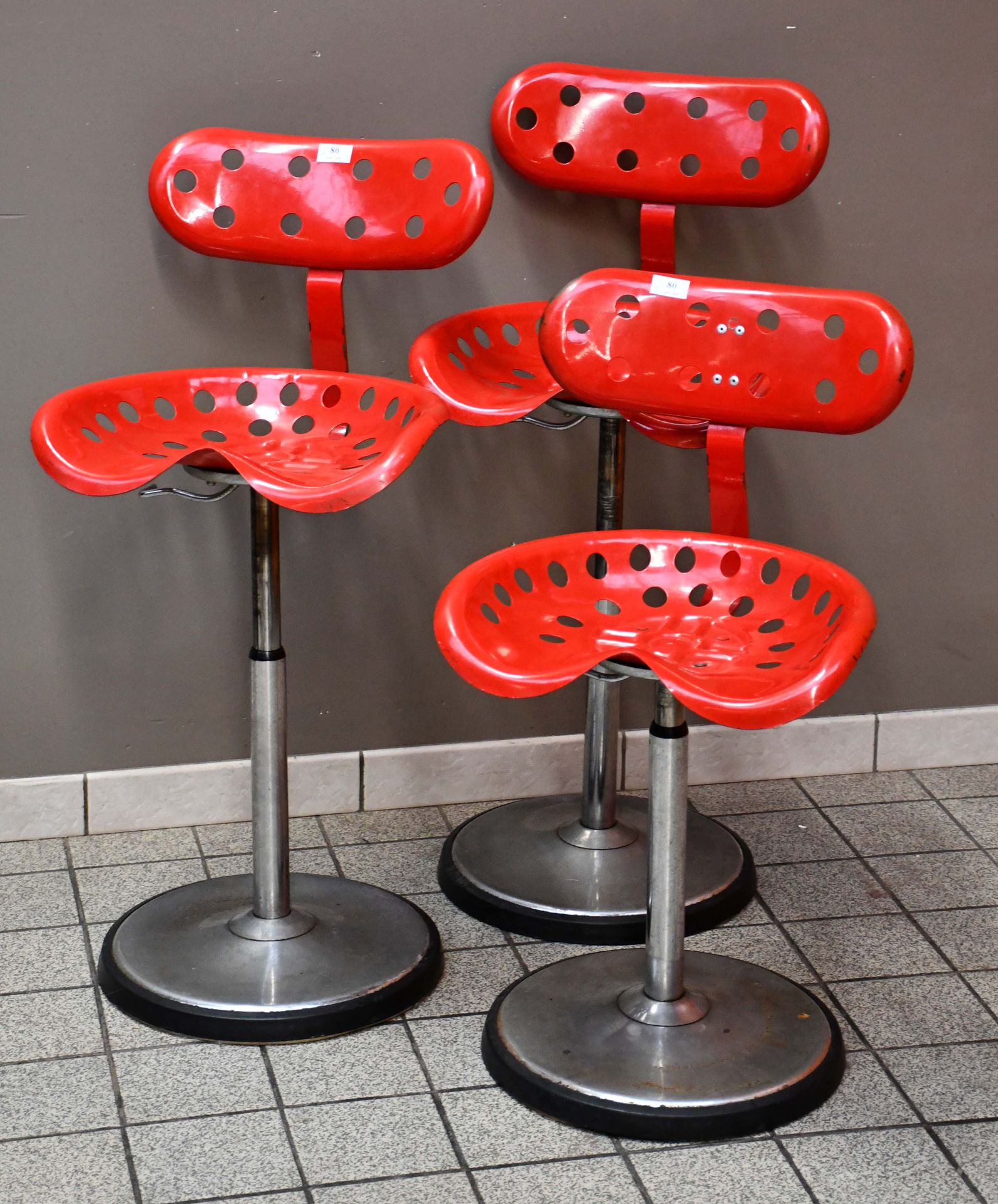 Null Series of three vintage "tractor" stools with backrest, perforated seat in &hellip;