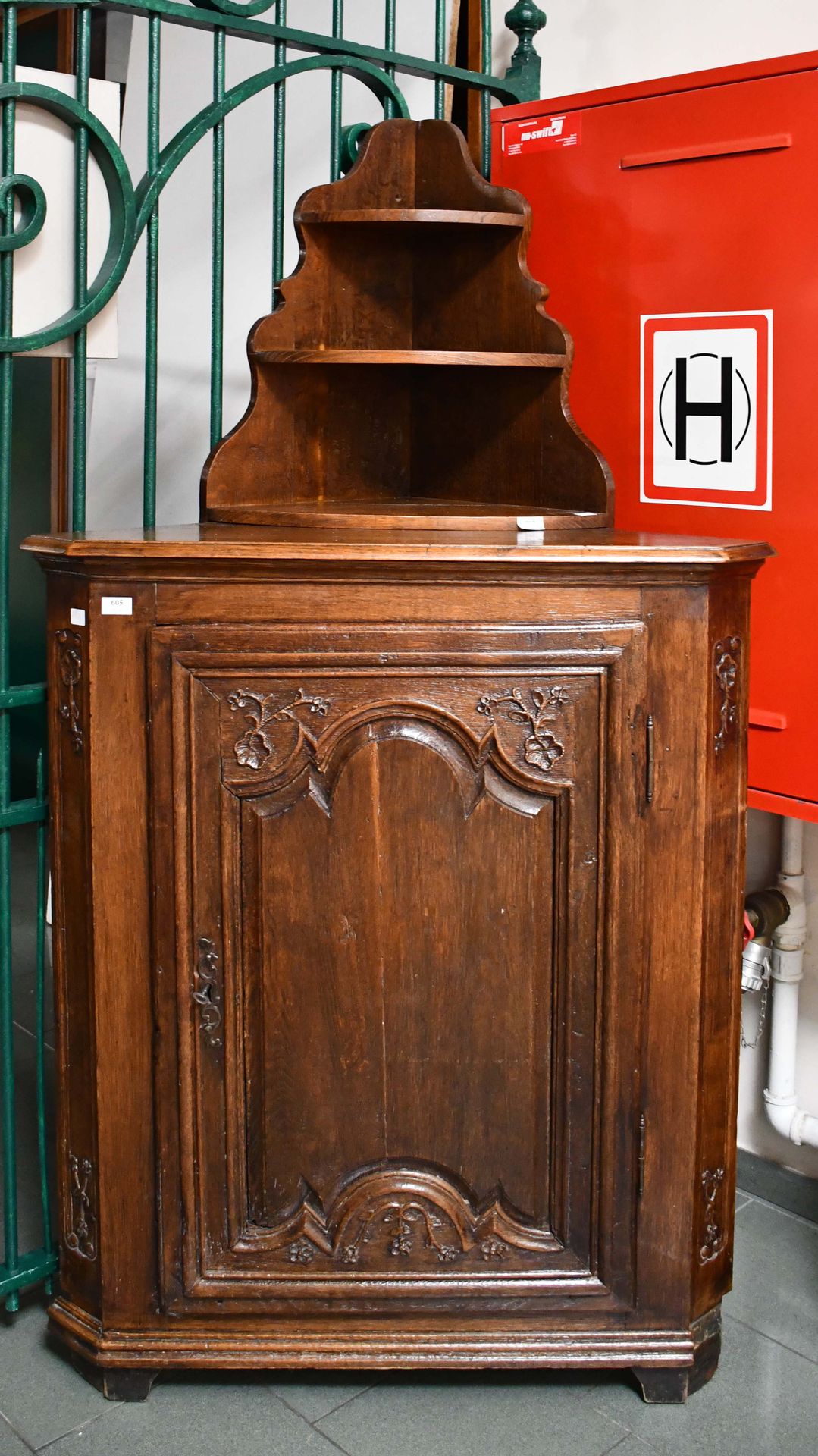 Null Corner in carved oak, opening to a molded door, the cut sides; topped by a &hellip;