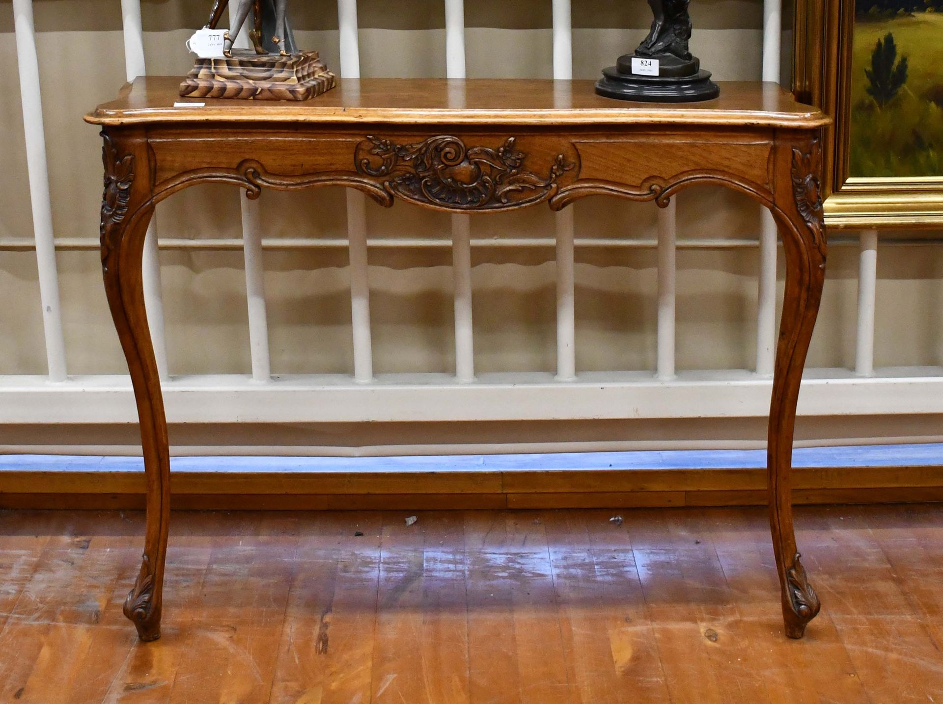 Null Pair of carved walnut consoles in the Regency style