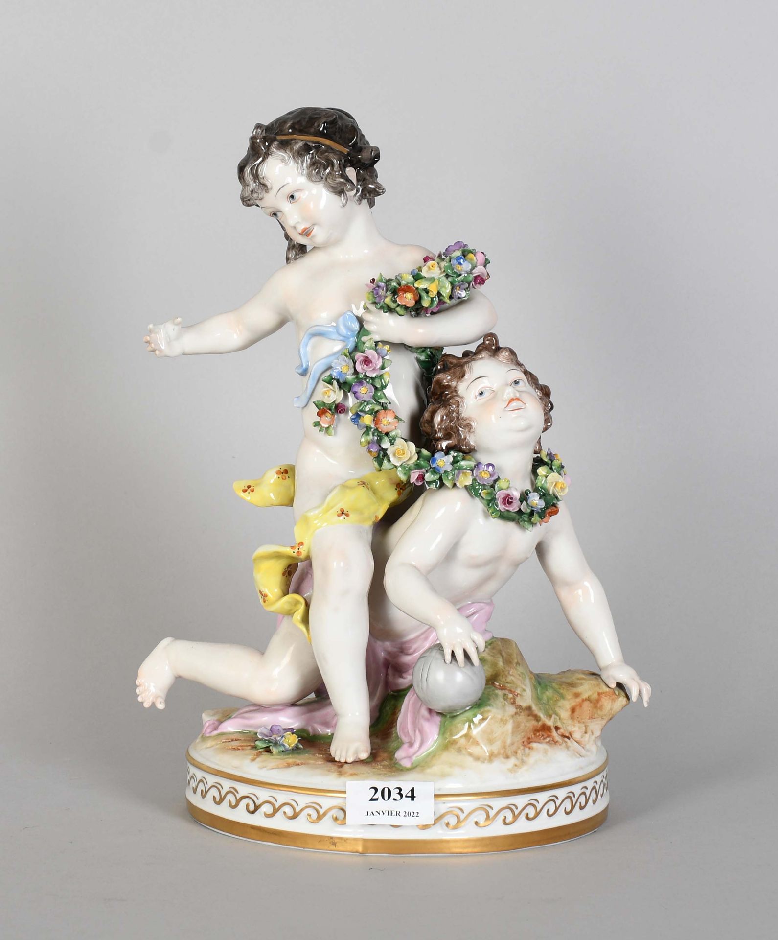 Null Saxony

Polychrome porcelain group: "Two children at play and floral garlan&hellip;
