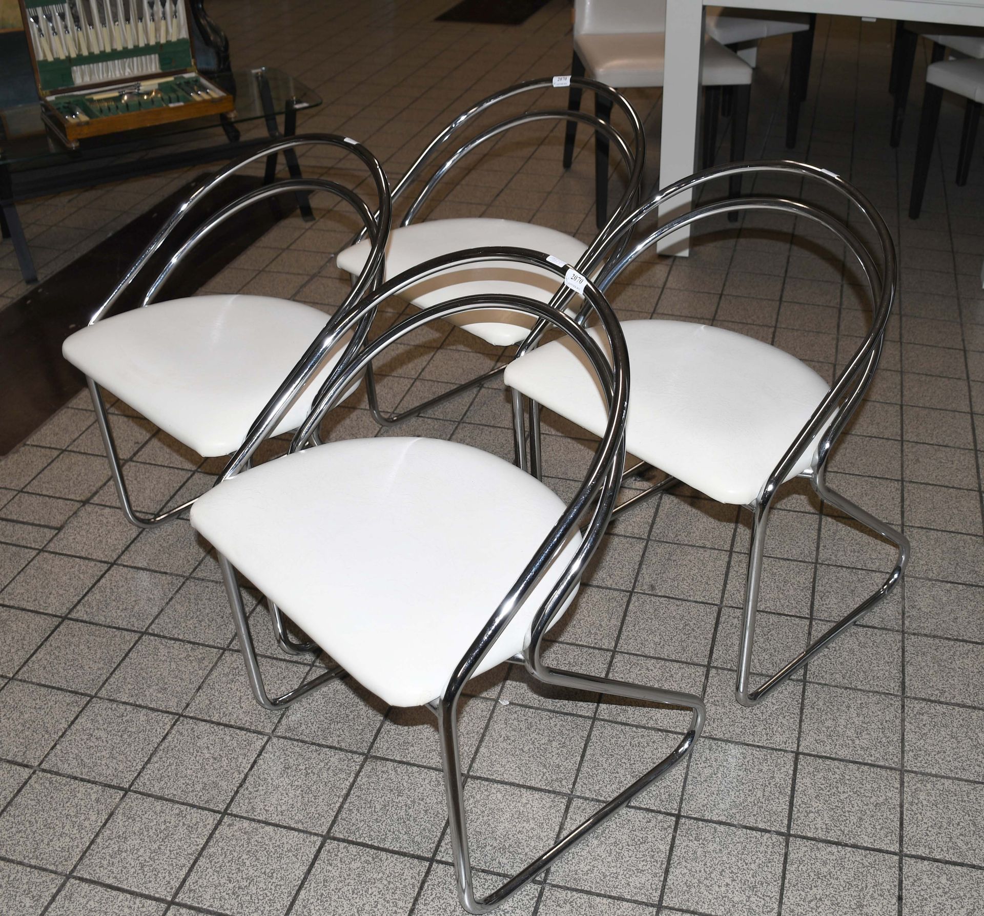 Null Set of four vintage tubular chrome chairs with white skai seat