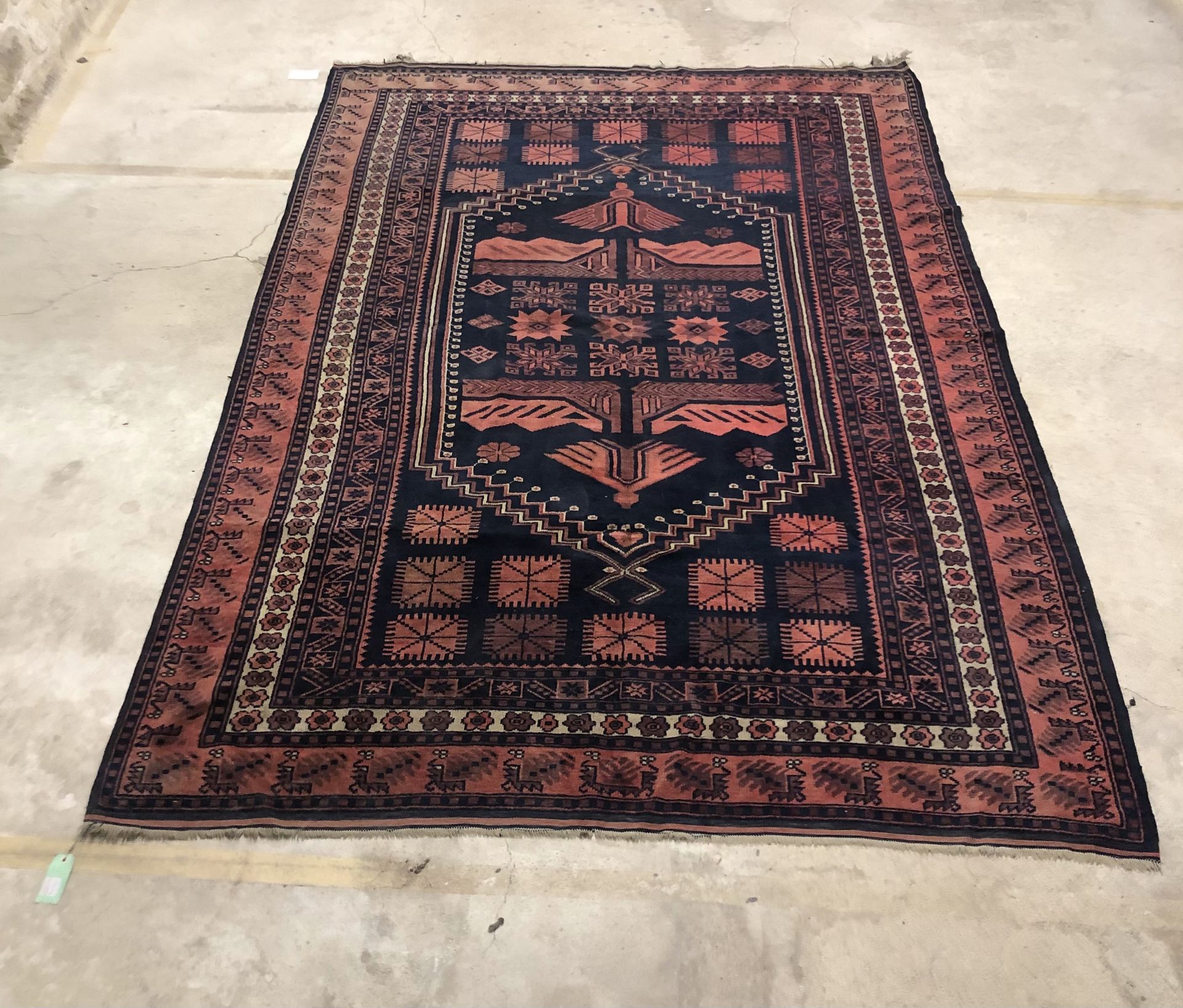 Null Wool carpet featuring a central medallion with geometric decoration on a re&hellip;