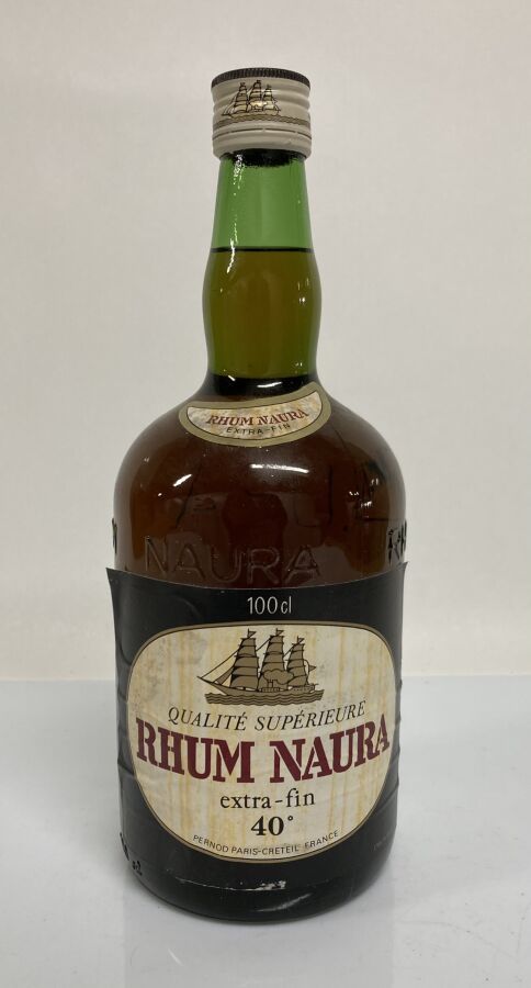 Null 1 Bottle RHUM EXTRA-FIN NM Naura (e.T.H; clm.S; embossed bottle; 100 cl)