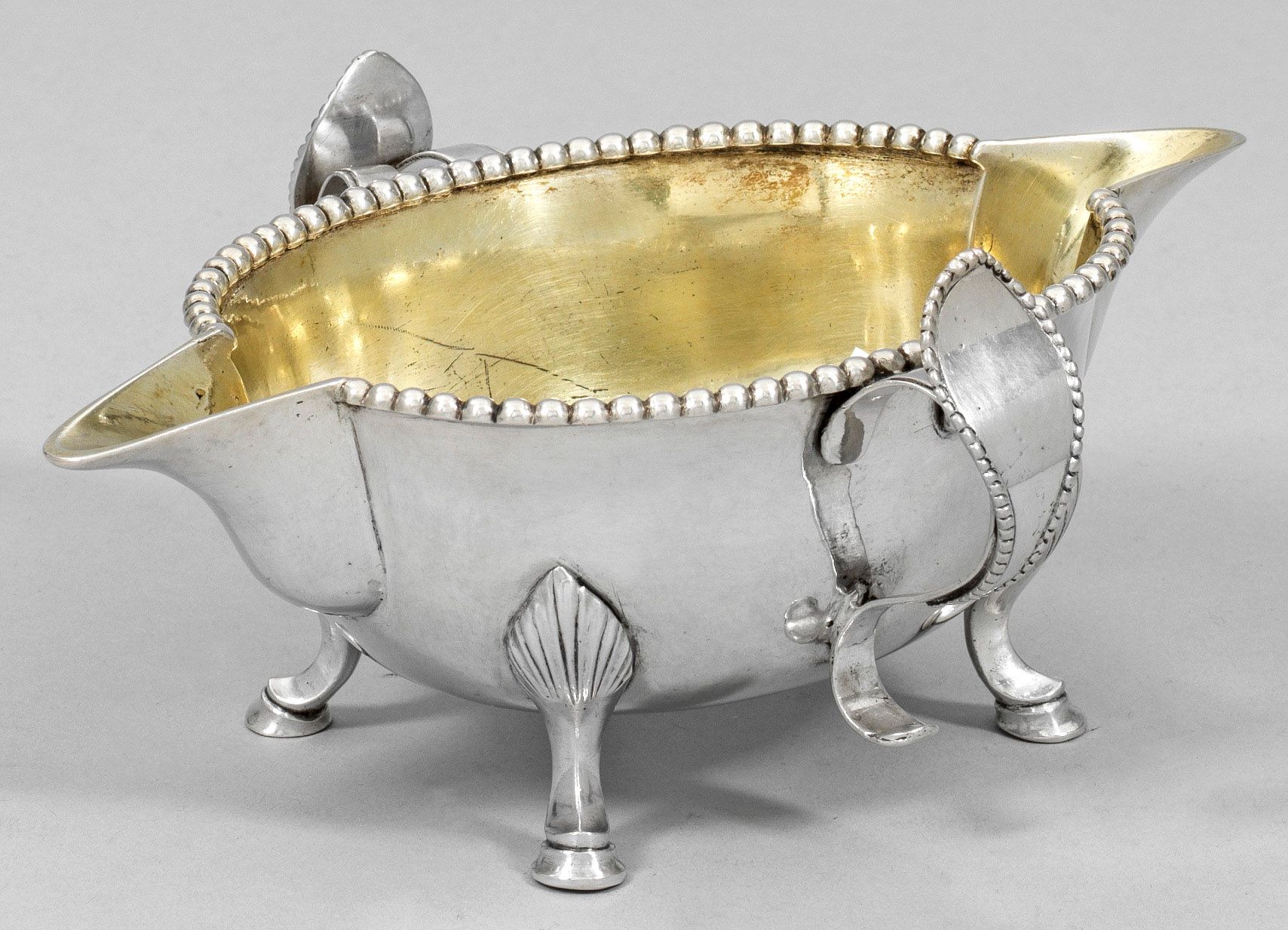 Null Rare, classicist silver sauce boat. Deeply moulded, ovoid bowl over four fl&hellip;