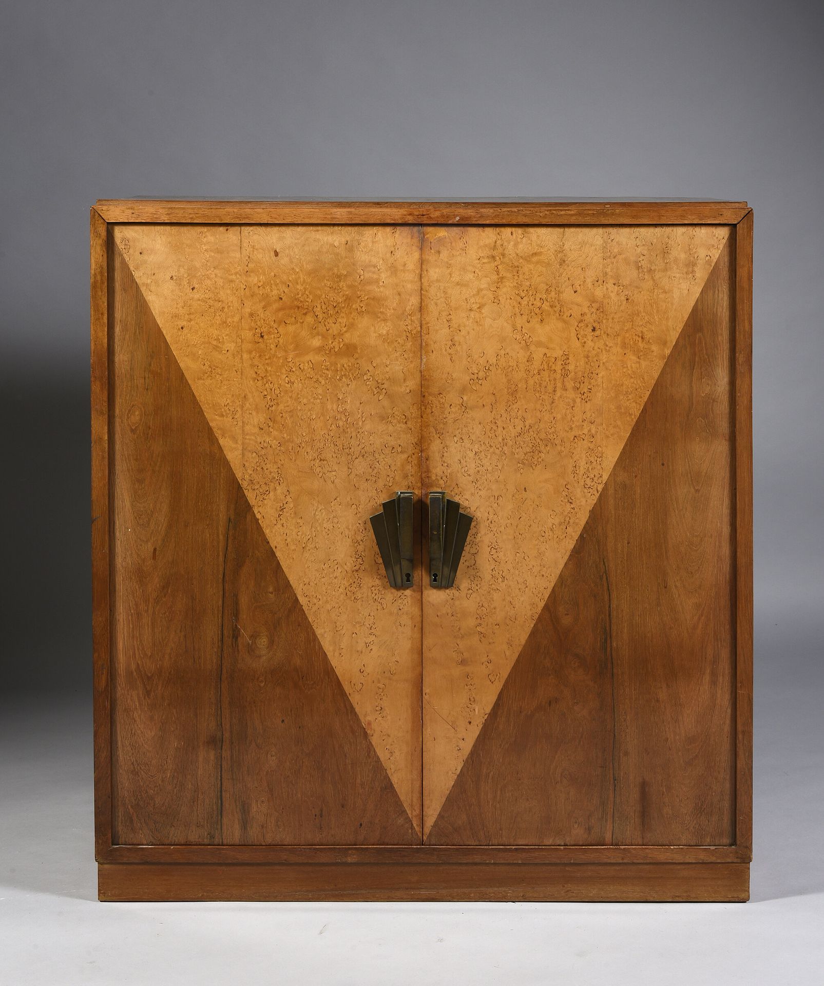 Null A two-leaf cabinet with a V-shaped veneer in burr sycamore on a mahogany ba&hellip;