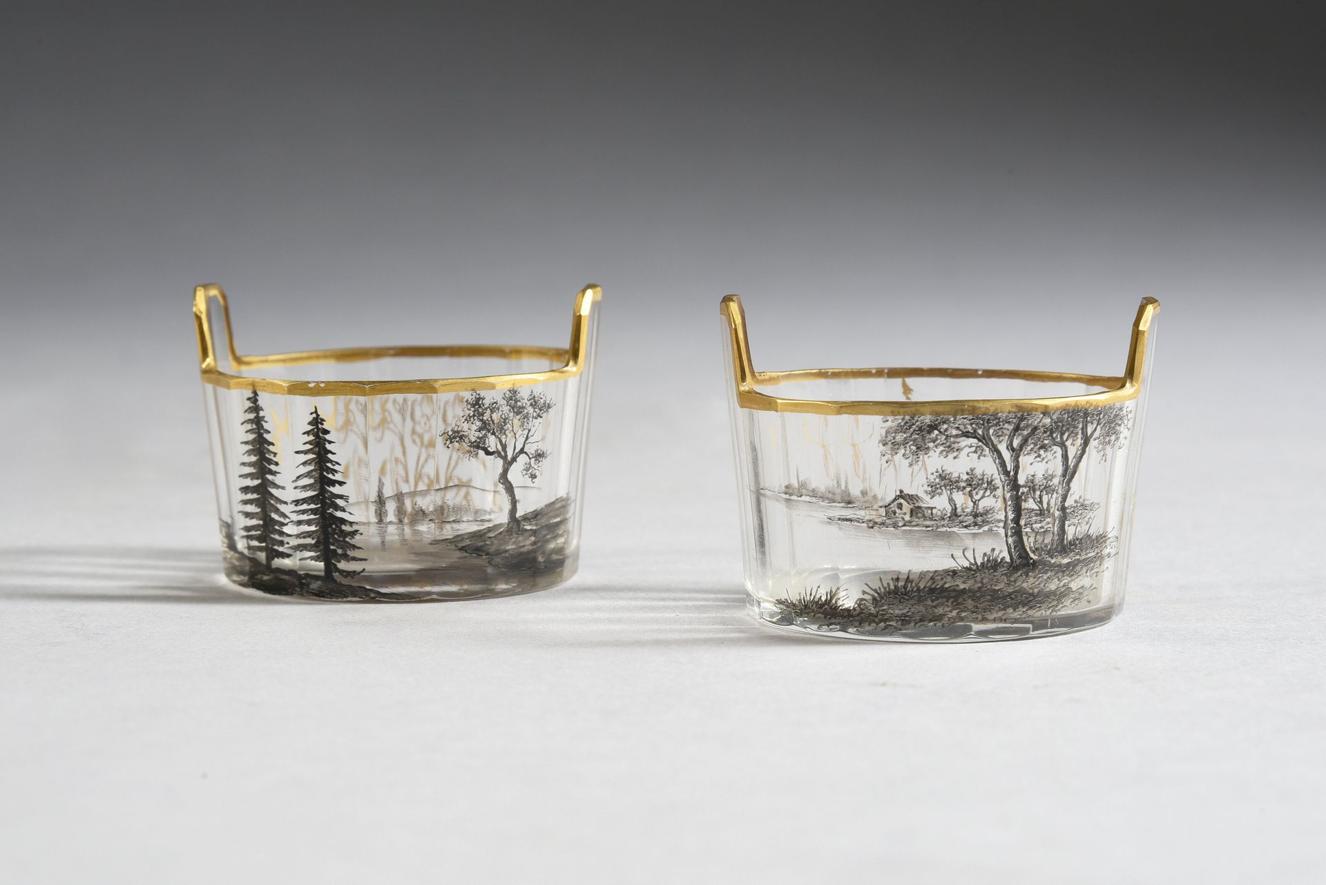 DAUM Nancy 
Two cut crystal saltcellars, enamelled decoration of landscapes in g&hellip;