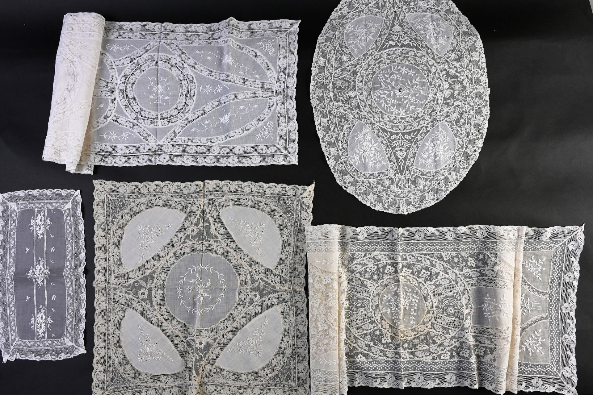 Null Table runners and doilies in bonnet background, early twentieth century.
Fi&hellip;