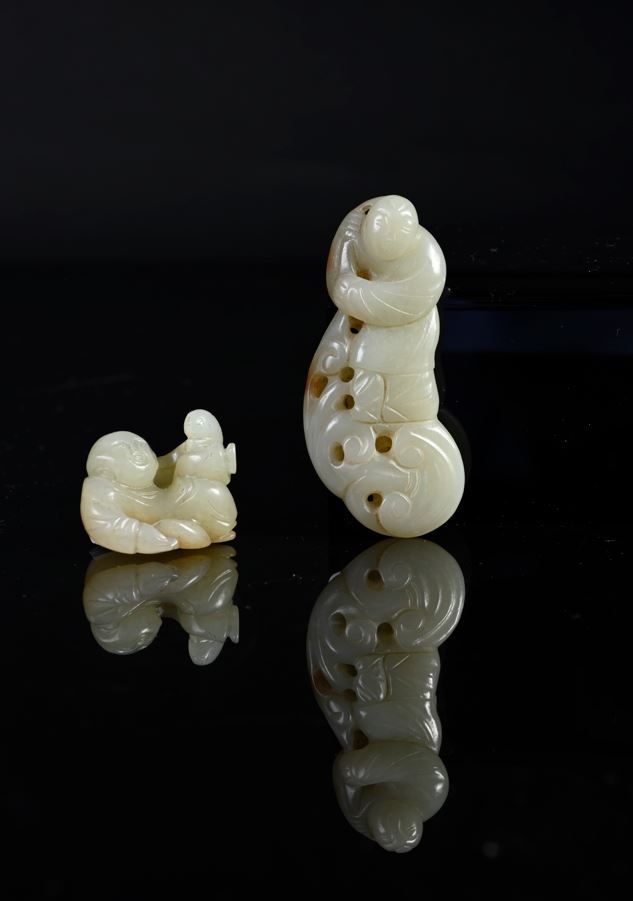 CHINE, XVIIIe siècle Two celadon jade carved groups One representing a child, th&hellip;