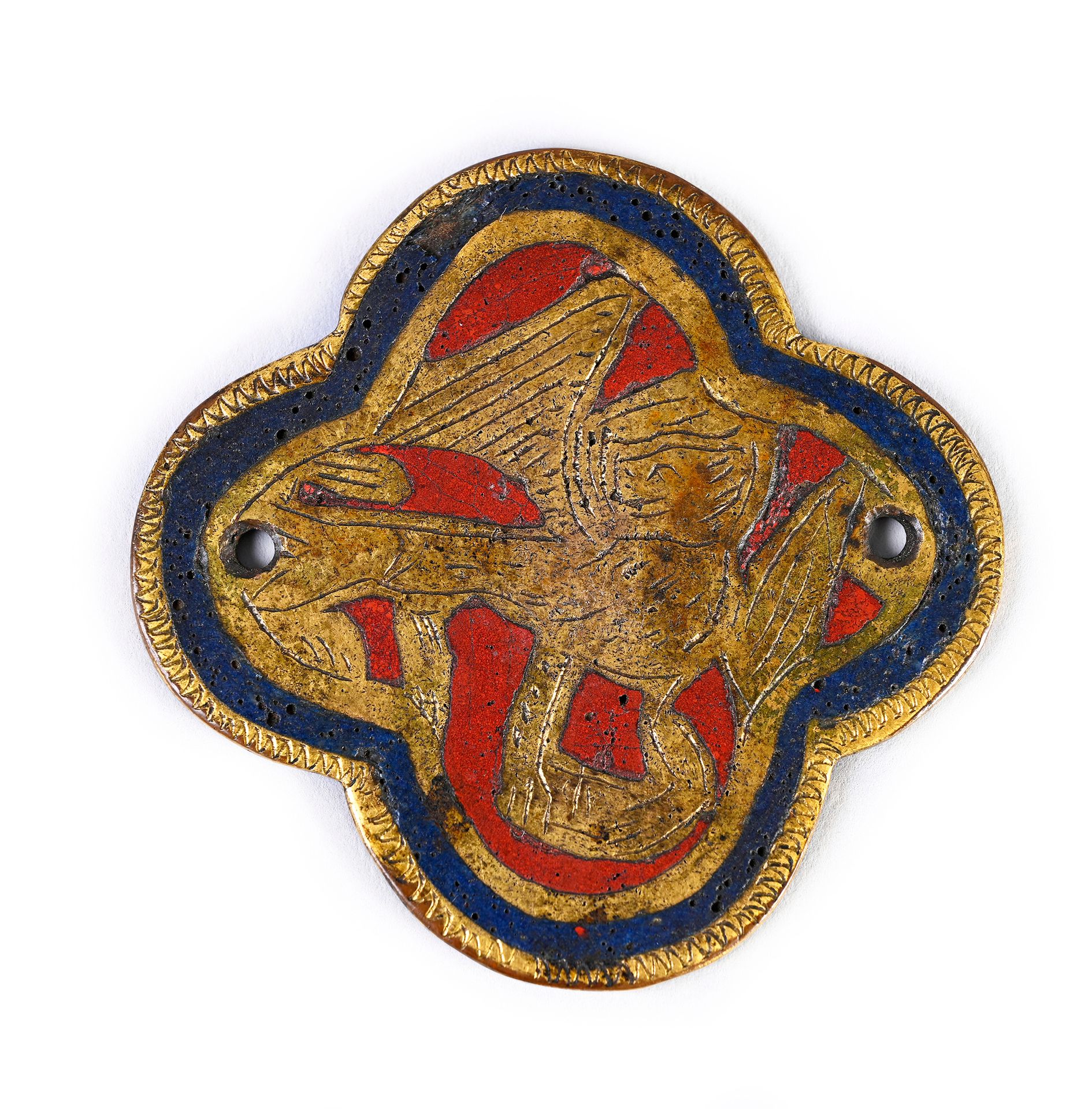 Null 小的四叶贴花徽章，用champlevé和镀金珐琅，蓝色和红色珐琅装饰着圣马克的狮子。
默兹河谷，约1300年
H.5.5厘米
(非常轻微的损坏)