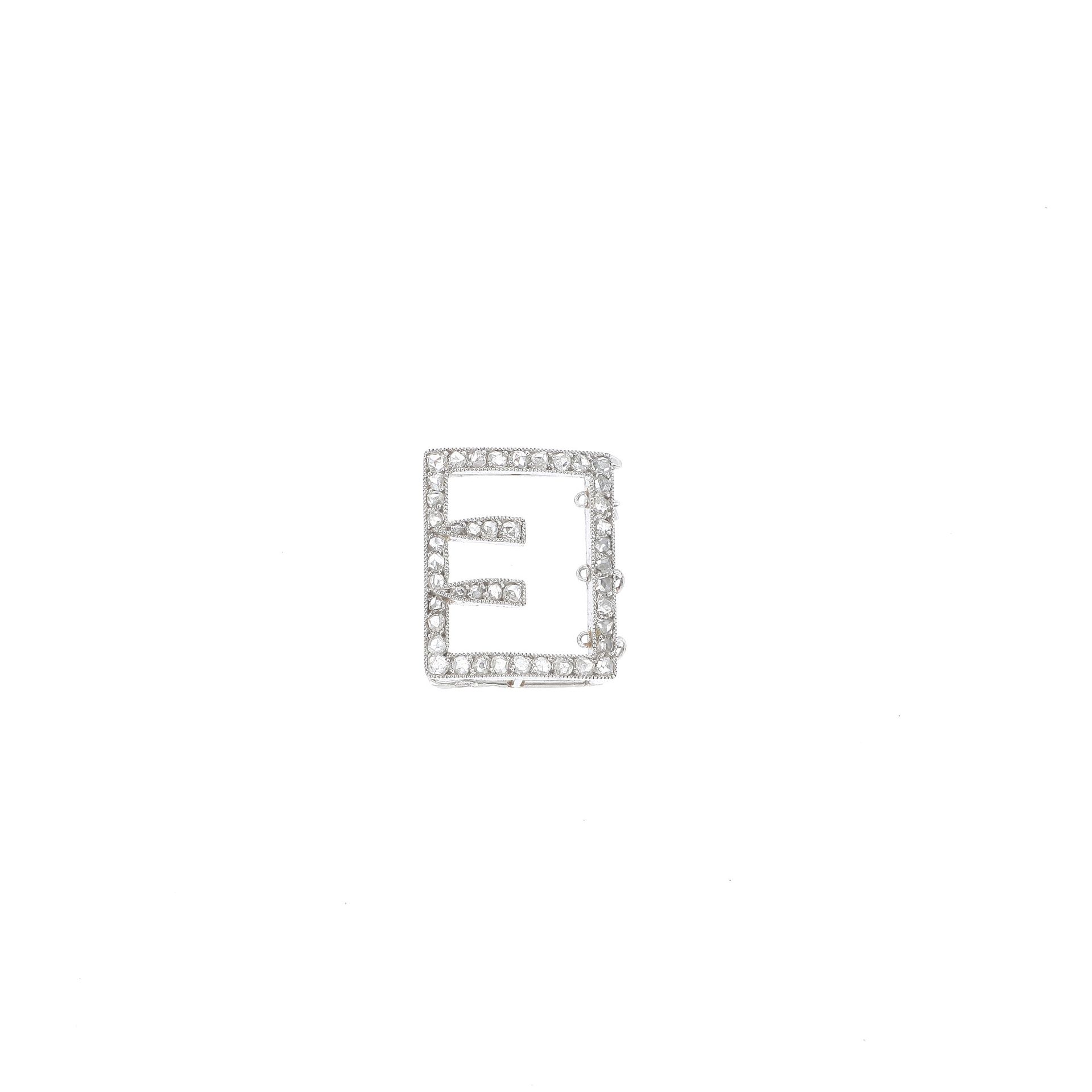 Null CARTIER

PART OF A CLASP 

in white gold, set with diamond tables. 

Circa &hellip;