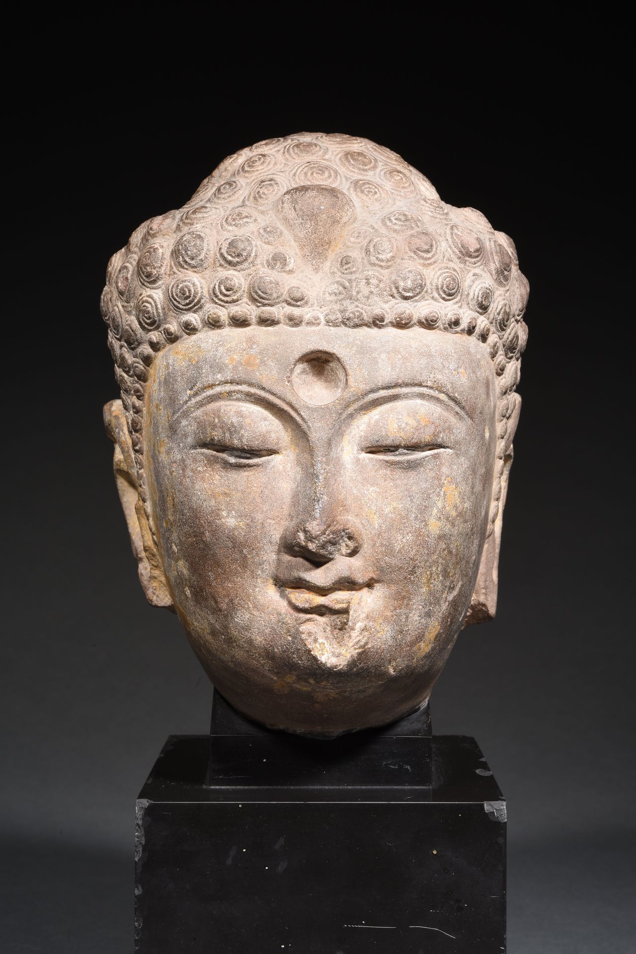 Null BUDDHA HEAD 

In grey limestone, the mouth sketching a slight smile, and th&hellip;