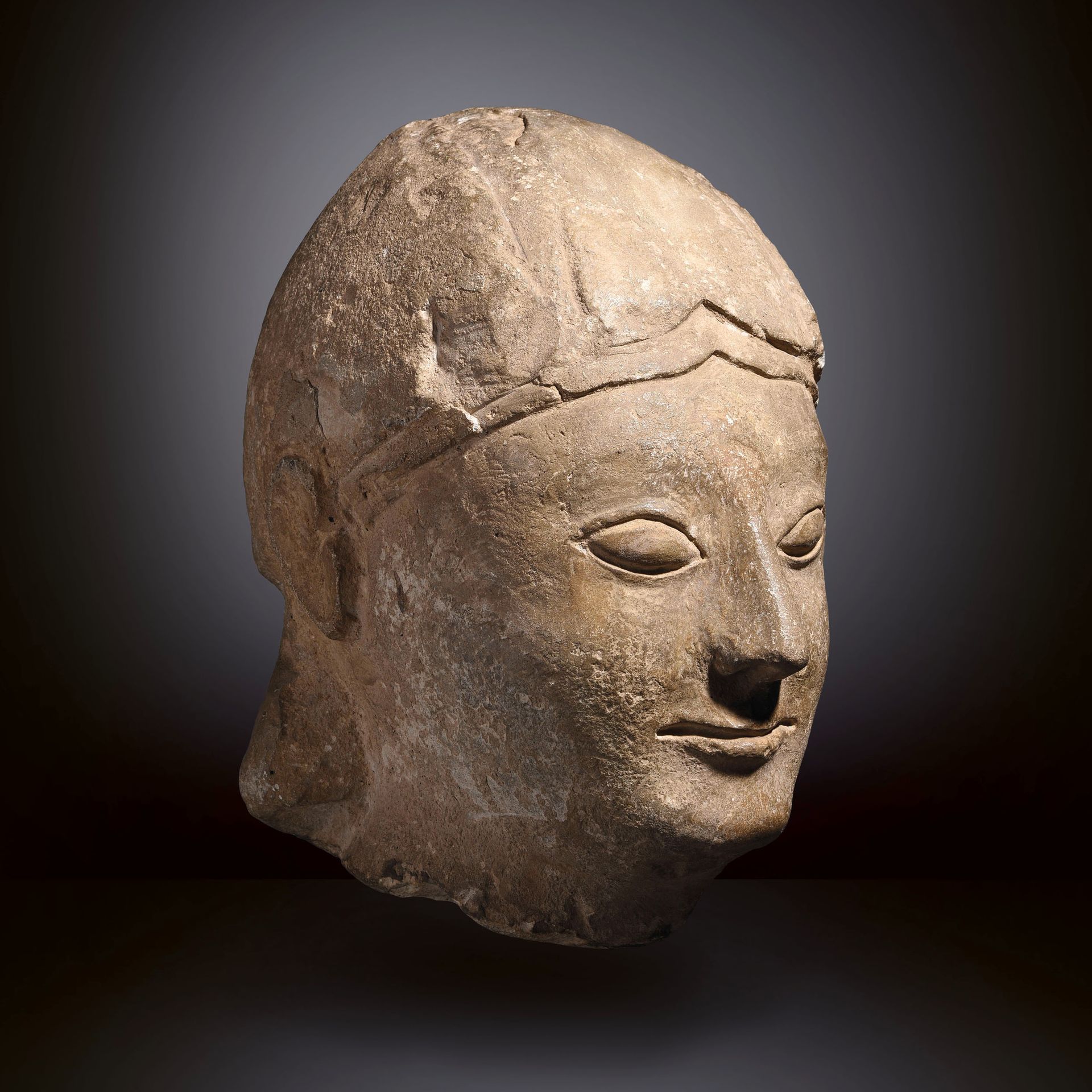 Null MALE HEAD

Cyprus, end of the 6th century B.C. 

Limestone with patina. Res&hellip;