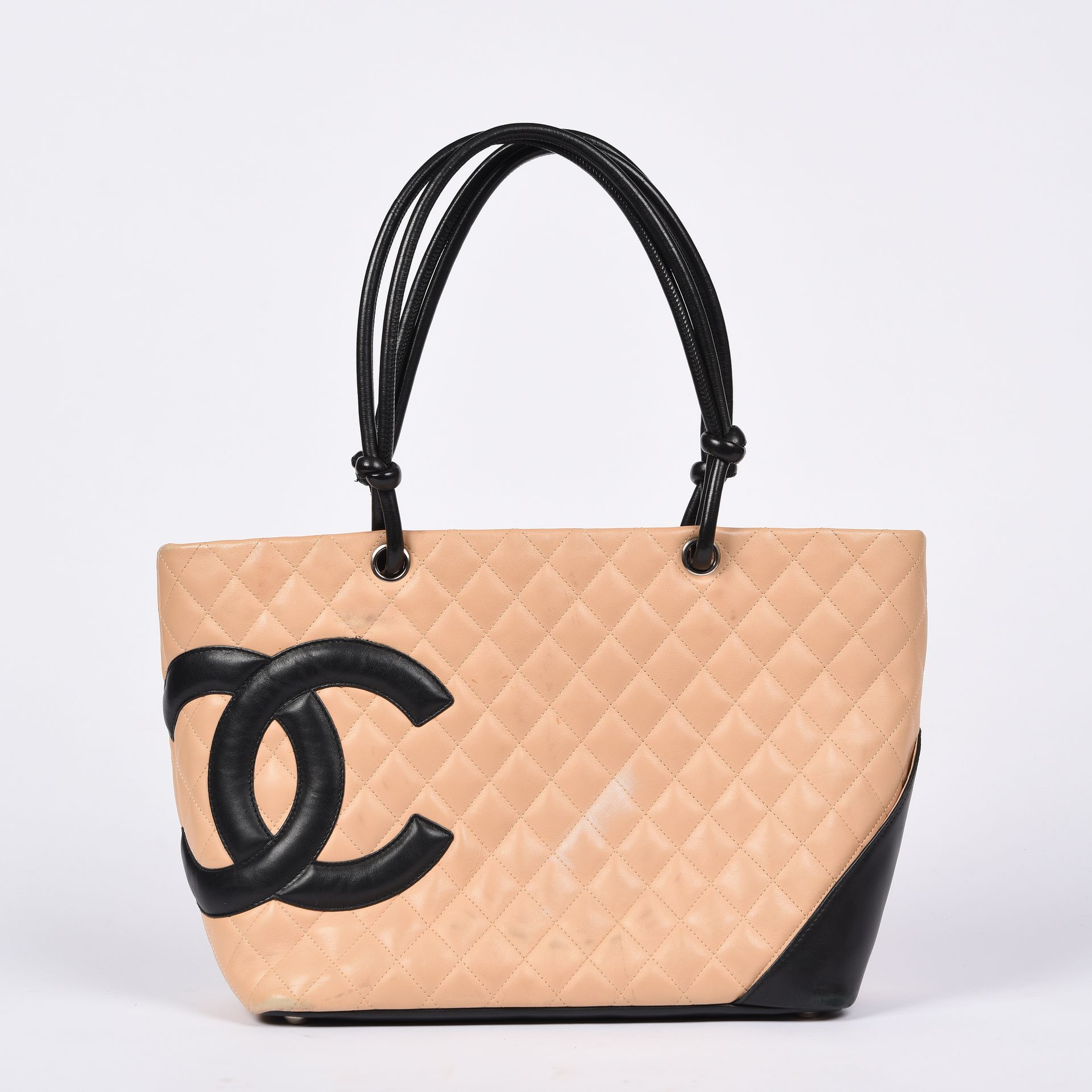 Null CHANEL

Cambon" bag in beige and black quilted leather, silver metal trim, &hellip;
