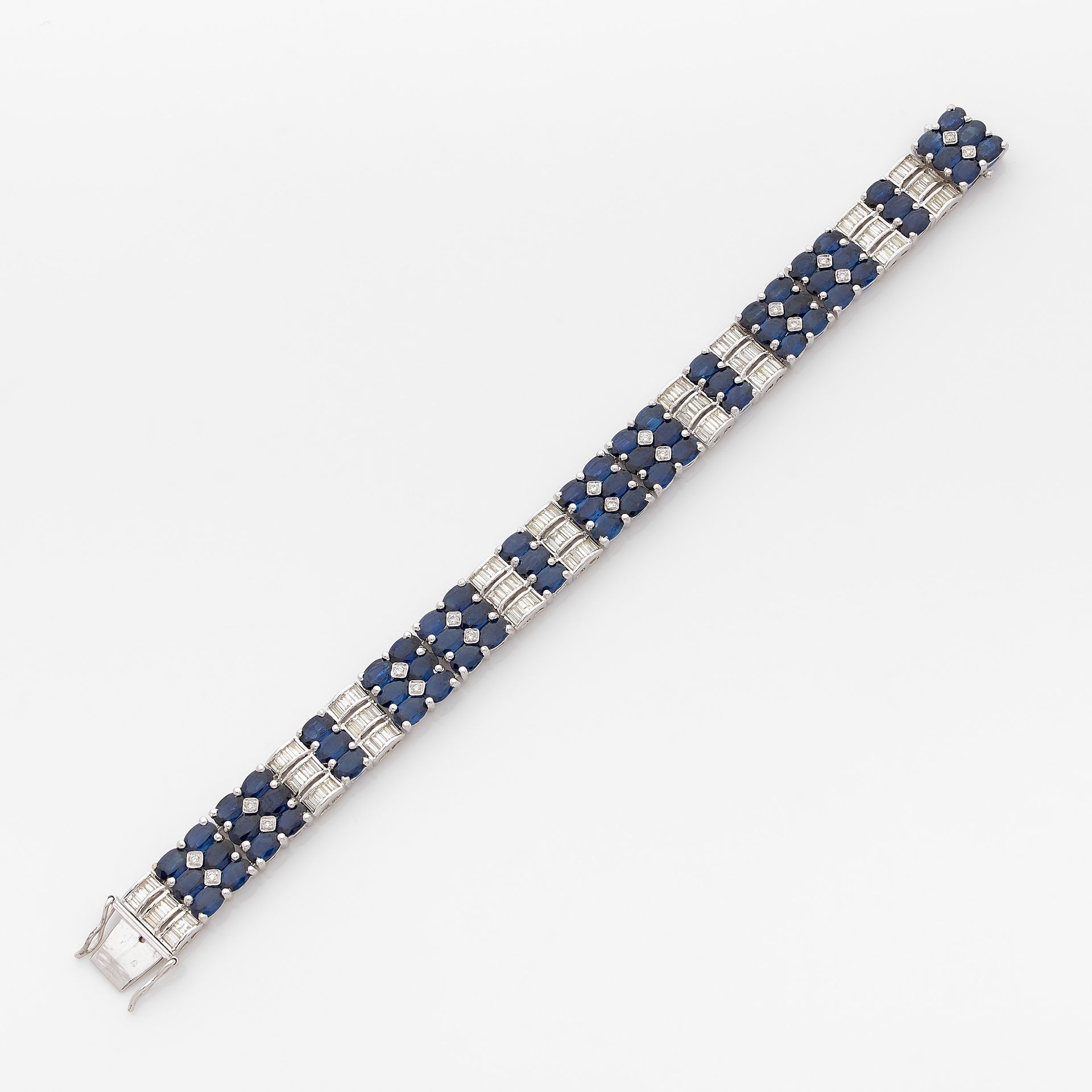 Null RIBBON BRACELET

in white gold, in three rows of oval sapphires alternated &hellip;