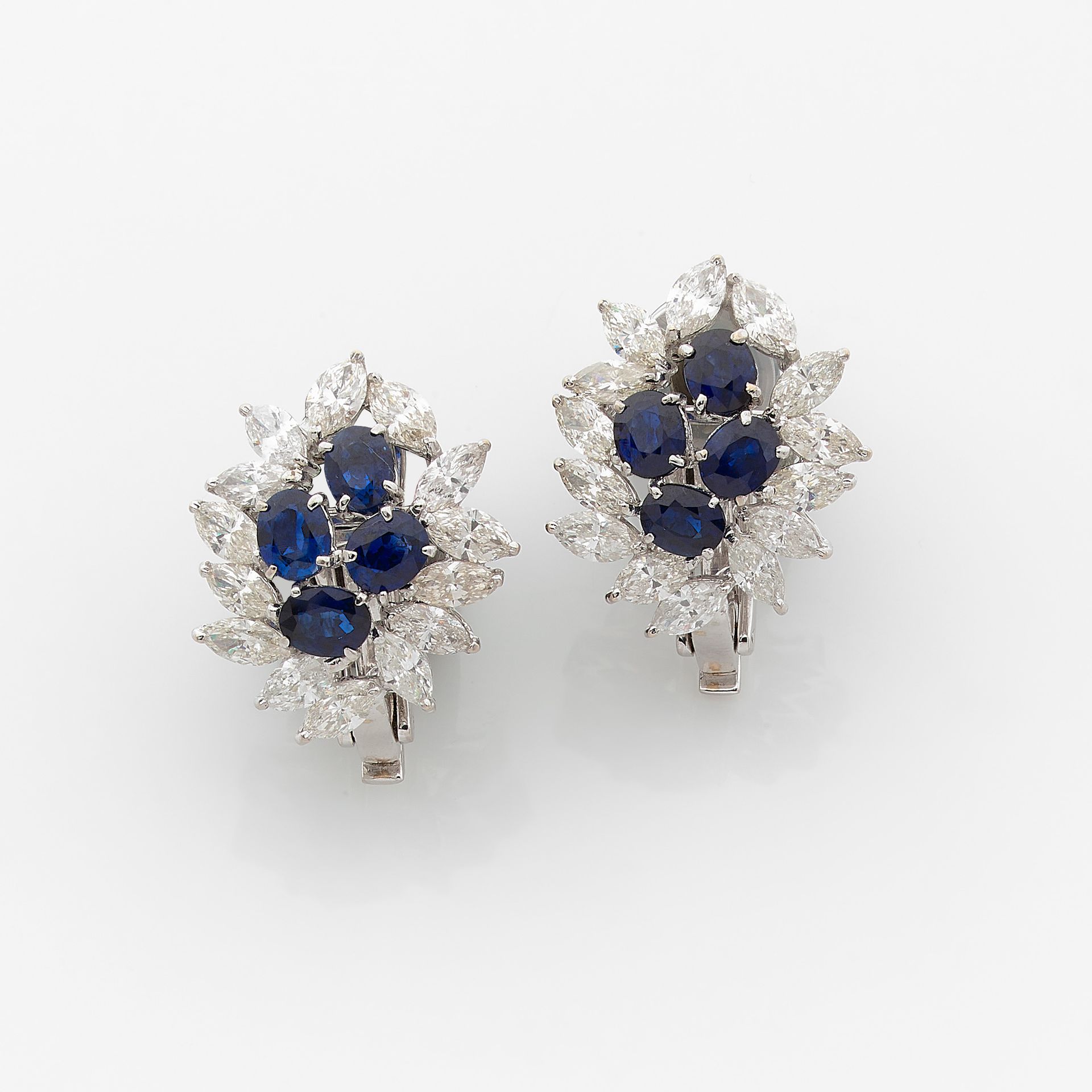 Null PAIR OF EARRINGS

in white gold, a bunch of oval sapphires underlined by na&hellip;