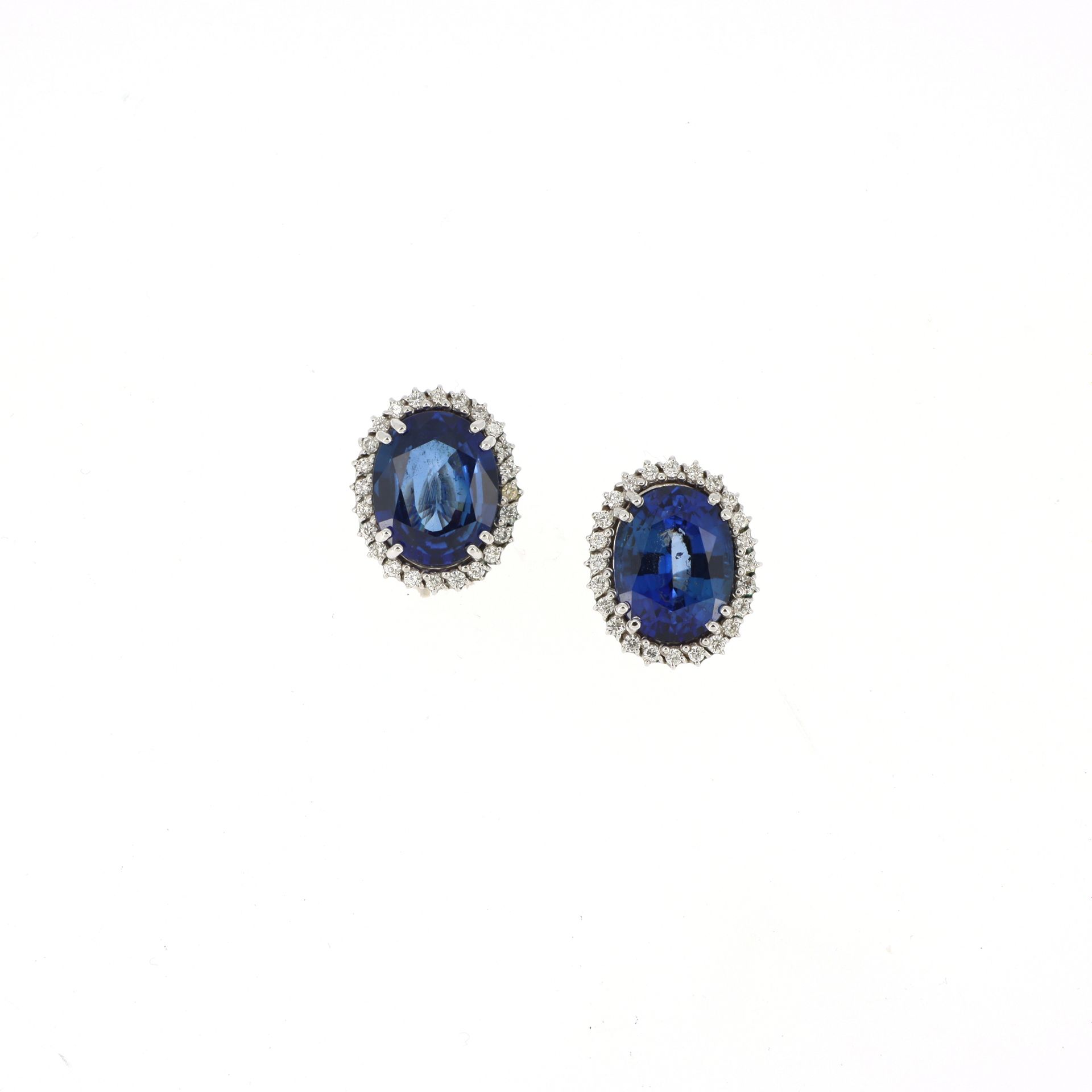 Null PAIR OF EAR CLIPS
in white gold, centered of synthetic sapphires of oval cu&hellip;