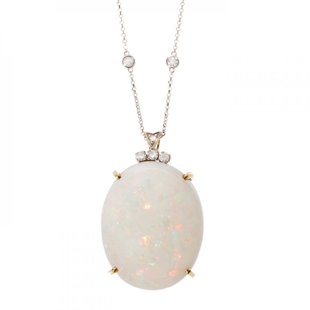 18kt yellow gold claw set opal pendant with 18kt white gold chain and diamonds. &hellip;