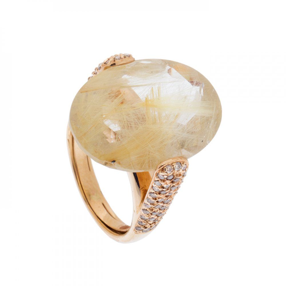 Null Ring in 18kt yellow gold. With large oval-cut rutilated quartz. Shoulders p&hellip;