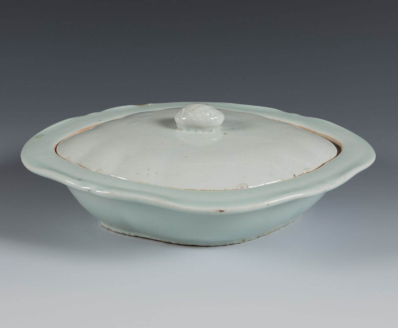 Null Celadon fountain with lid. China, 19th century.
Celadon porcelain.
Slightly&hellip;