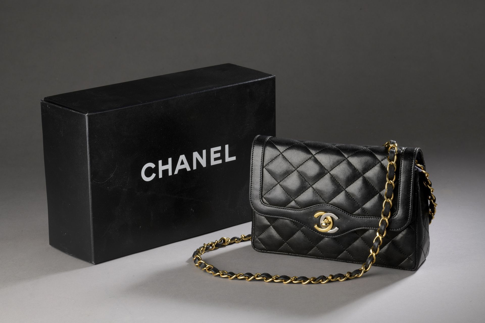 CHANEL, circa 1995 Bag in partially quilted black lambs…