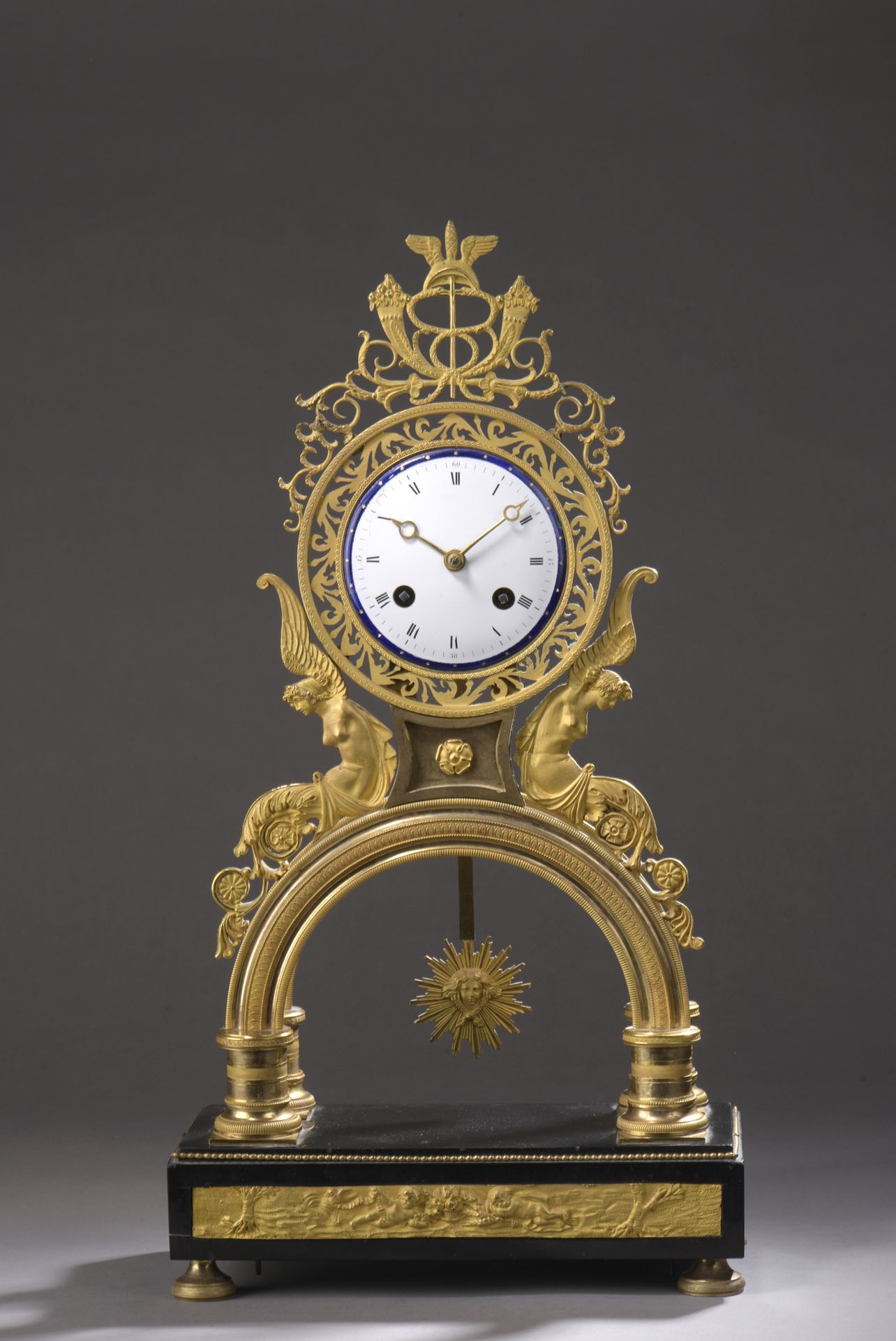 Null An ormolu and openwork clock decorated with foliage, horns of plenty and wi&hellip;