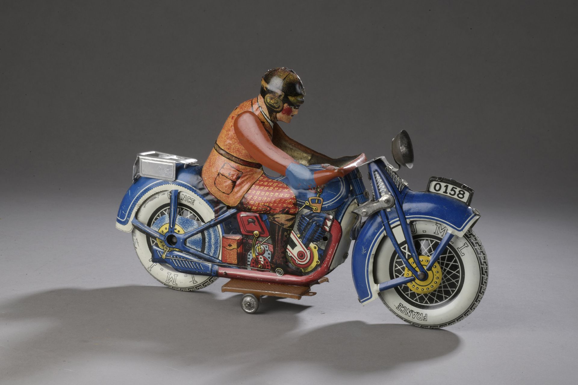 Null JML - 法国, 1936-1960 - 蓝色石印金属板摩托车，有摩托车手，编号0158，无头灯，轮胎为JML法国。

L. 30 cm