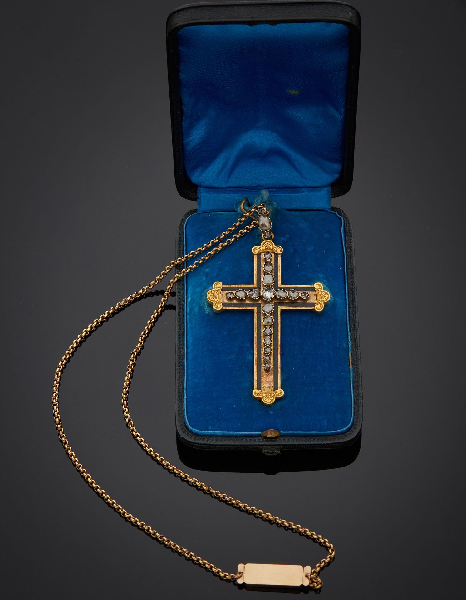 Null 
18K yellow gold 750‰ cross, set with rose-cut diamonds, bordered by a blac&hellip;