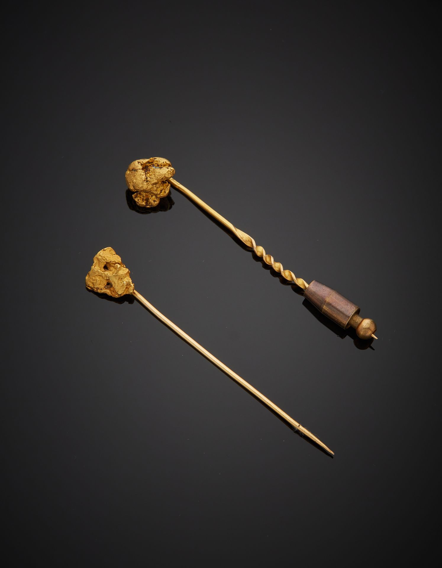 Null Two 18K yellow gold 750‰ tie pins, adorned with nugget-shaped motifs.

Weig&hellip;