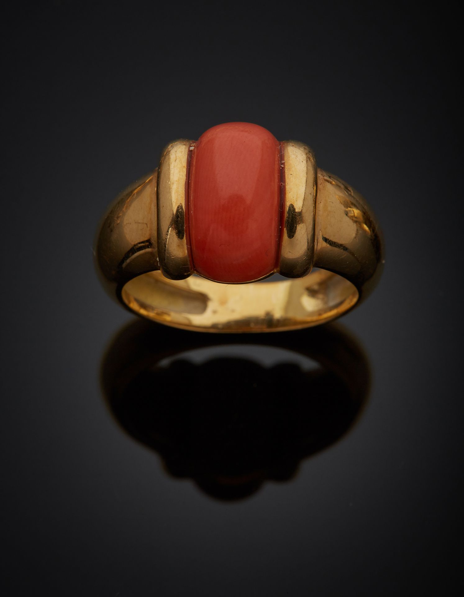 Null 14K yellow gold 585‰ band ring, set with a coral cabochon*. 

French work. &hellip;