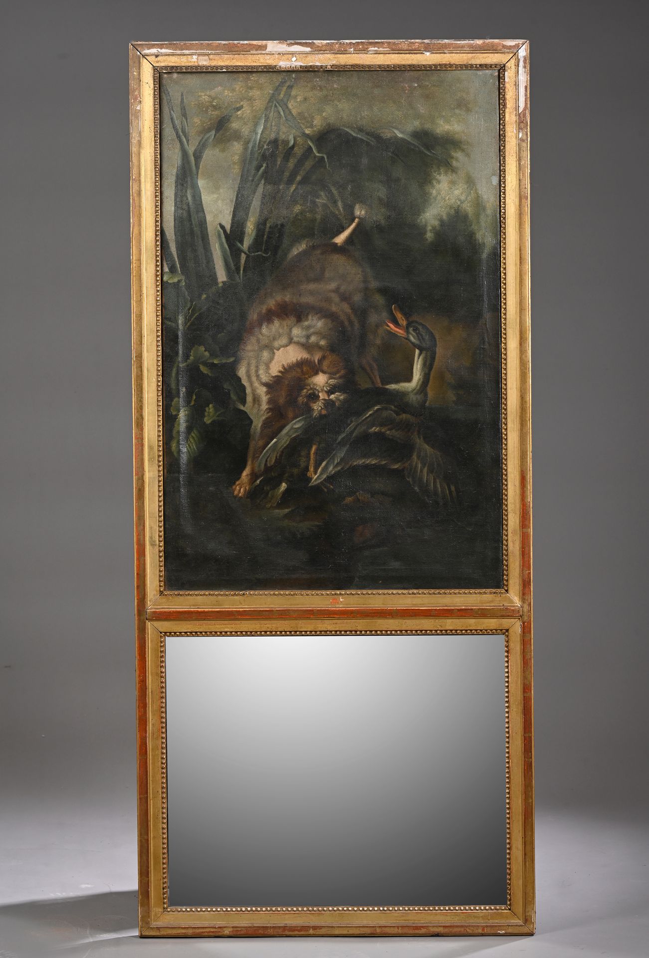 Null TRUMEAU en bois doré à miroir (au mercure) surmonté d’une toile d’après Oud&hellip;