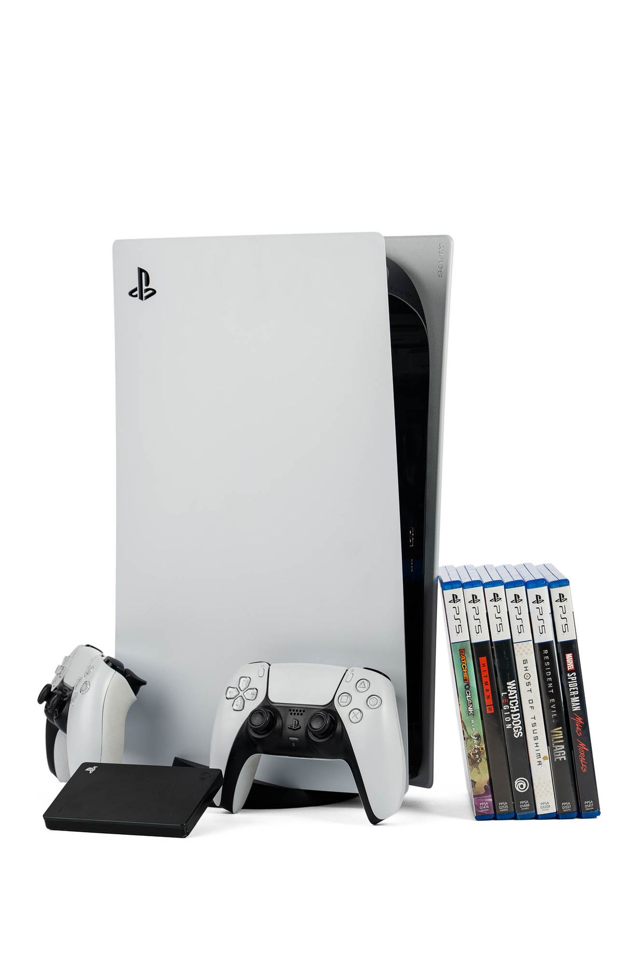 Une console PlayStation 5 avec 2 manettes, 6 jeux et un …