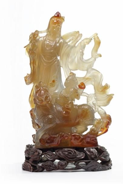 A Chinese agate Guanyin group Guanyin is carved standing wearing long robes and &hellip;