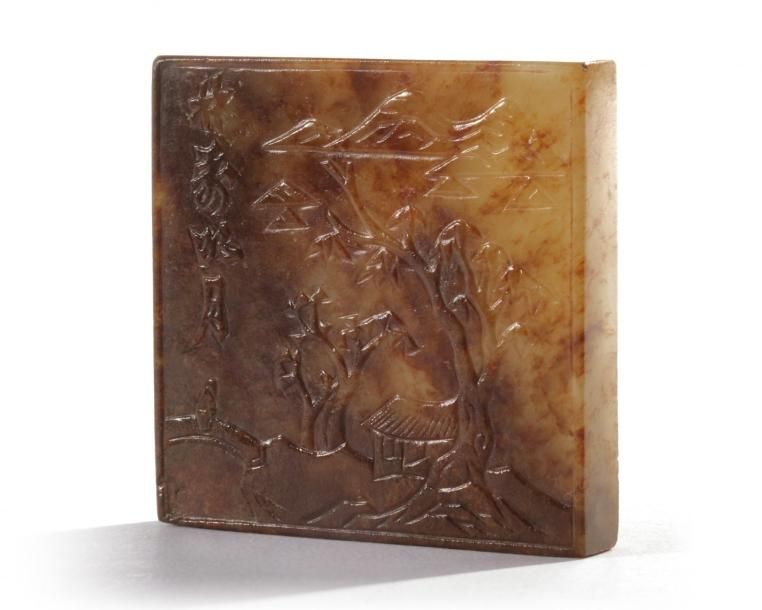 A Chinese celadon and russet jade square plaque The plaque is carved to one side&hellip;