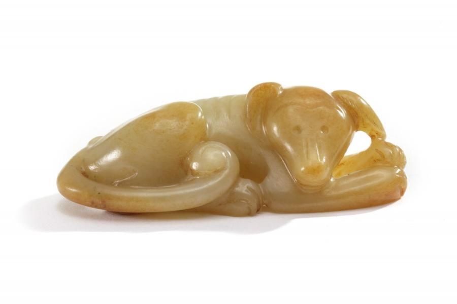 A Chinese celadon jade carving of a dog The dog is carved recumbent with its tai&hellip;