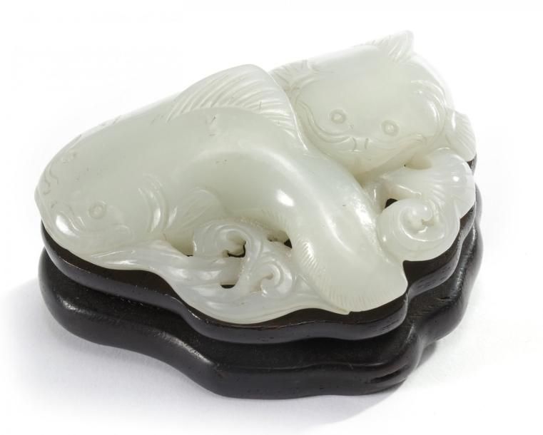 A Chinese pale celadon jade 'twin catfish' carving The piece is carved in the ro&hellip;