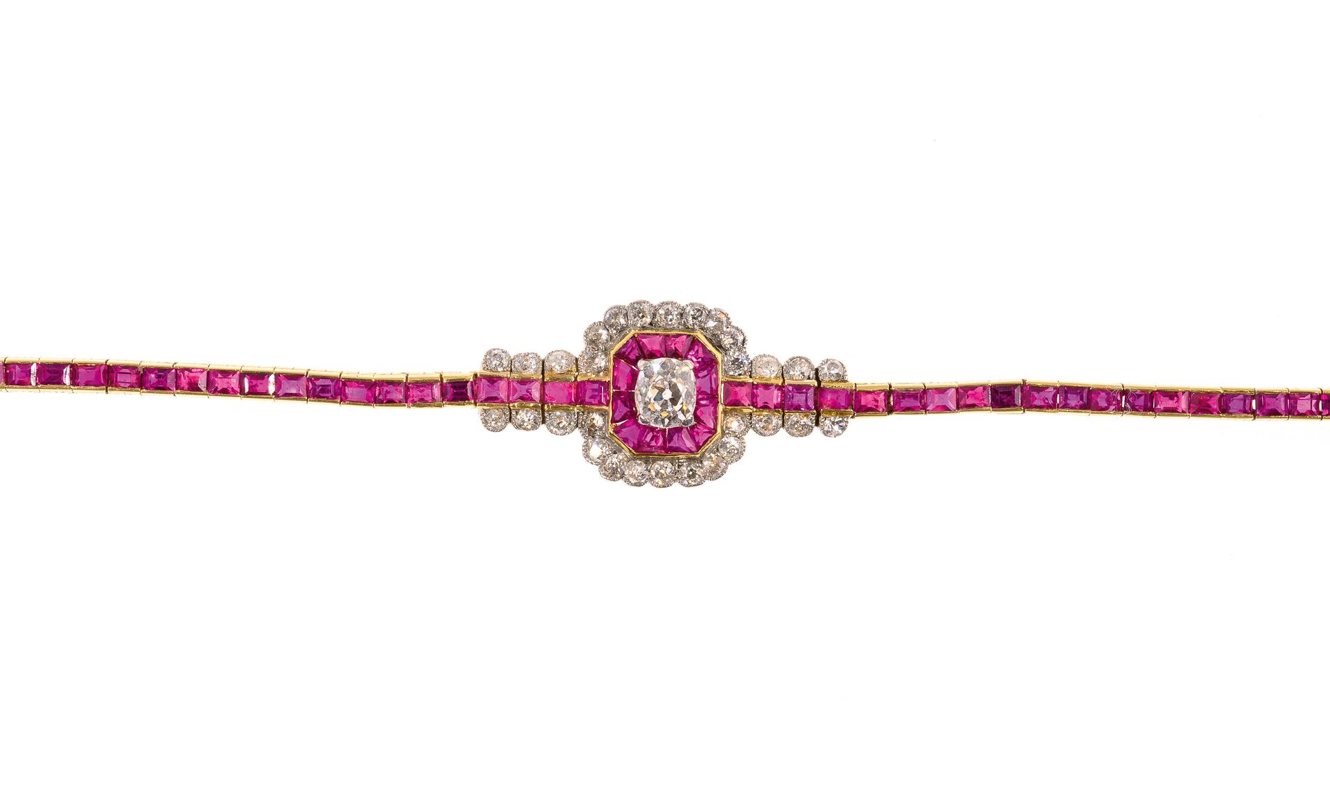 Null Gold line bracelet set with calibrated rubies and diamonds holding in its c&hellip;