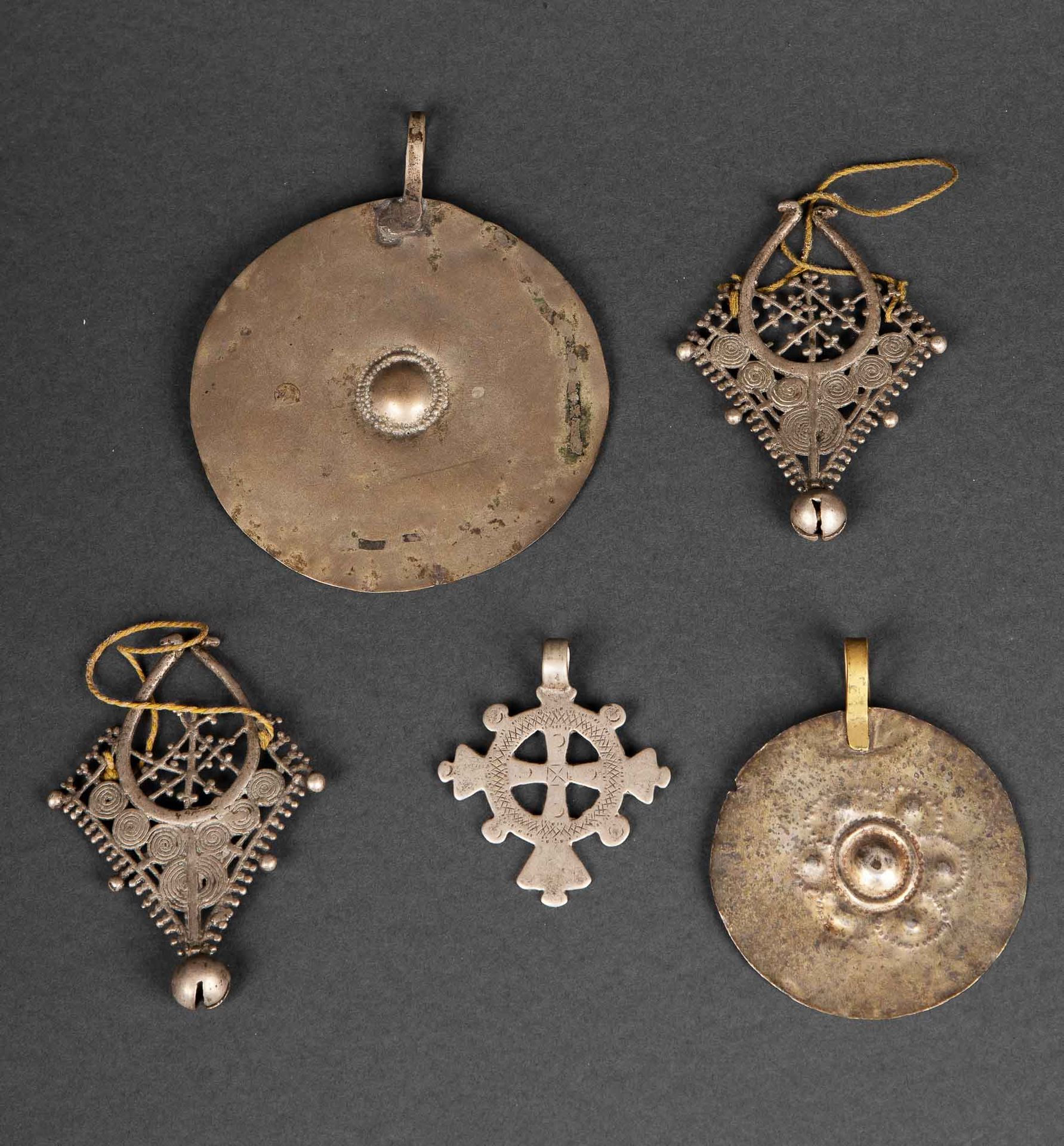 Null Set of five brass and silver ornaments with old patina and marks of use. Et&hellip;