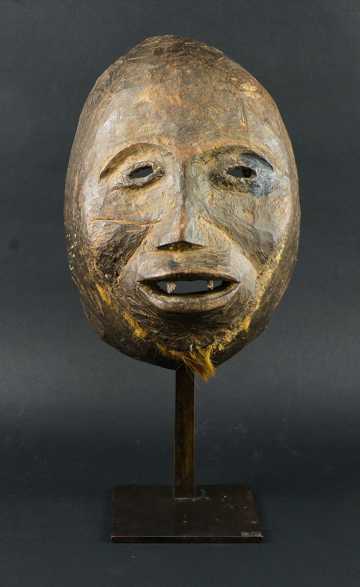 Null Wooden dance mask with old patina showing a face with a striking expression&hellip;