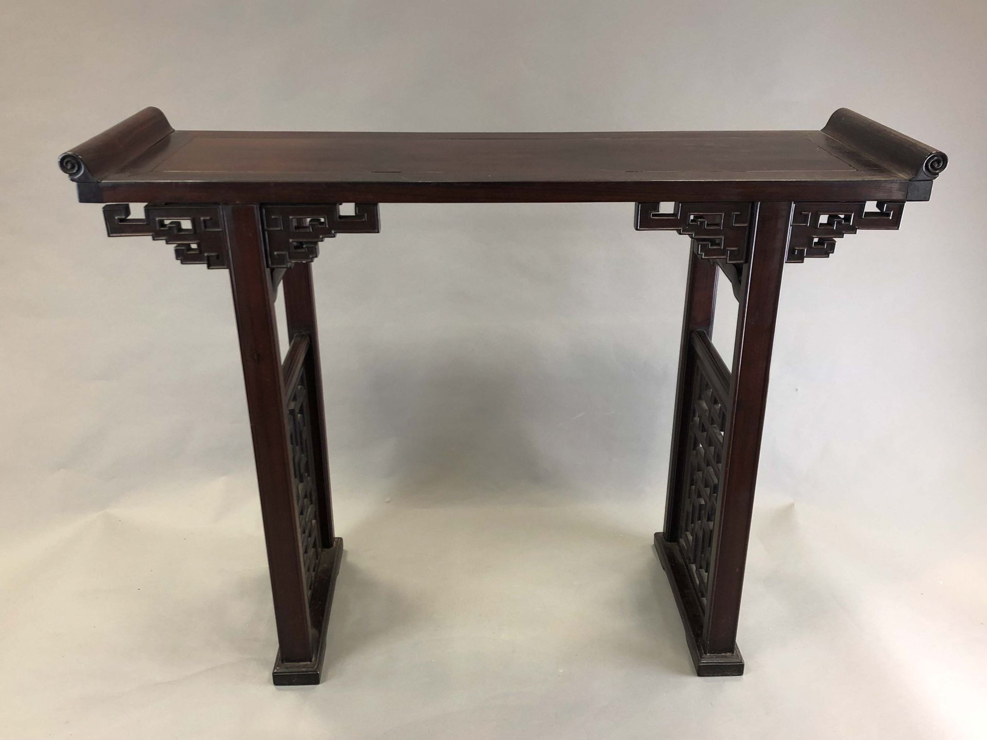 Null A carved wooden console made of hongmu wood, the elegant form comprising a &hellip;