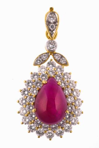Null Gold pendant centered with a pear-cut ruby cabochon in a diamond setting to&hellip;