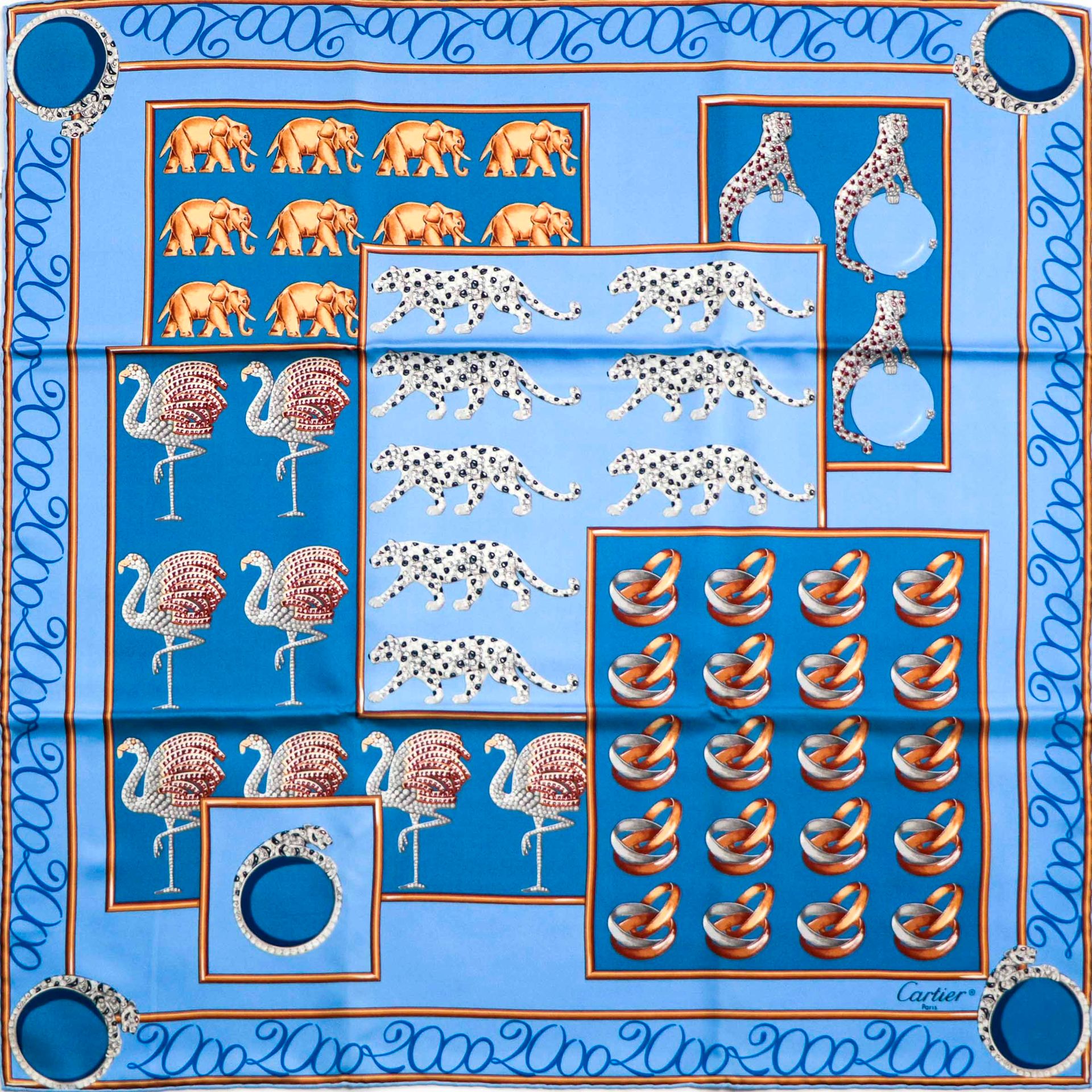 Null 卡地亚。多色丝质广场，蓝色背景上有豹子、"三位一体 "结婚戒指、粉色火烈鸟和大象的标志性设计