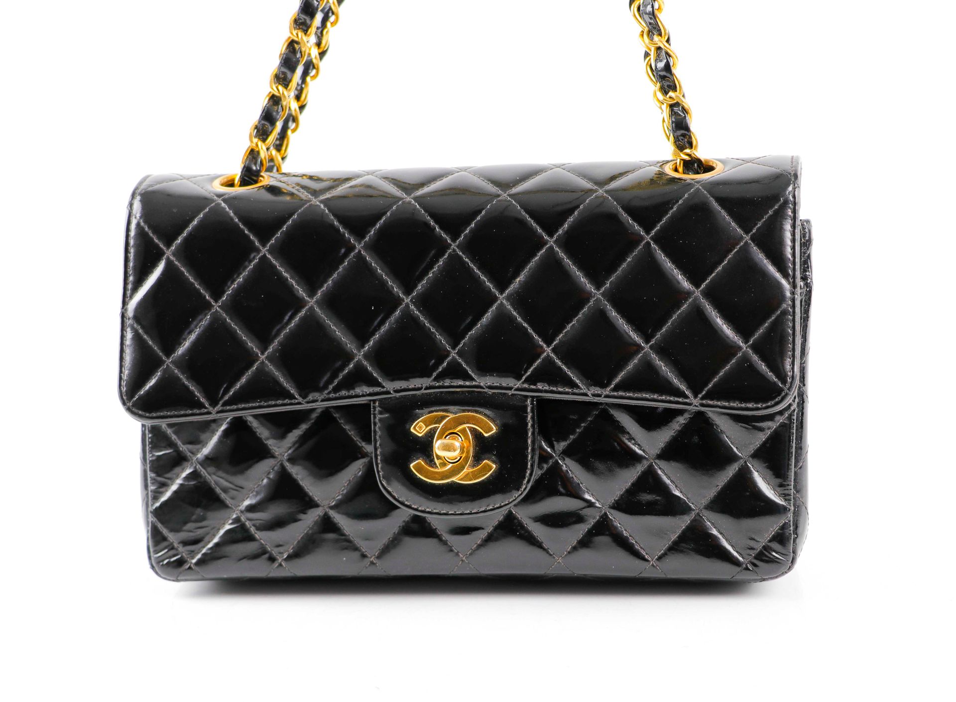 Null CHANEL. Timeless" bag in black quilted patent leather - Gold metal jewelry.&hellip;
