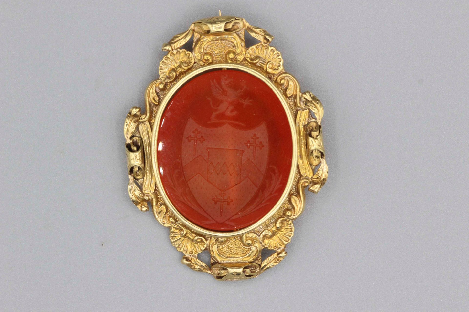 Null Gold brooch set with an intaglio on carnelian engraved with a coat of arms.&hellip;