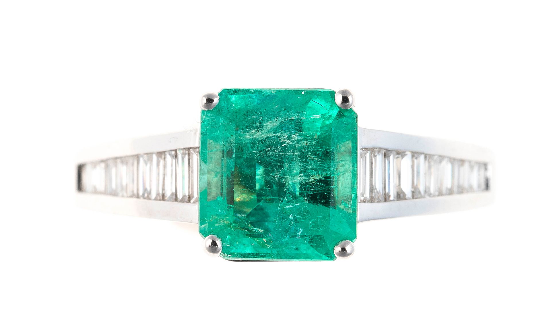 Null White gold ring centered on a 1.8 carat emerald cut emerald with baguette c&hellip;