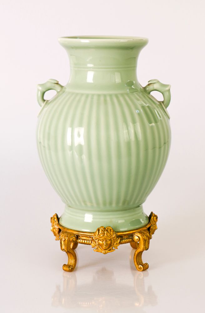 Null CHINA, 19th century. A celadon-glazed porcelain vase with a full and slight&hellip;