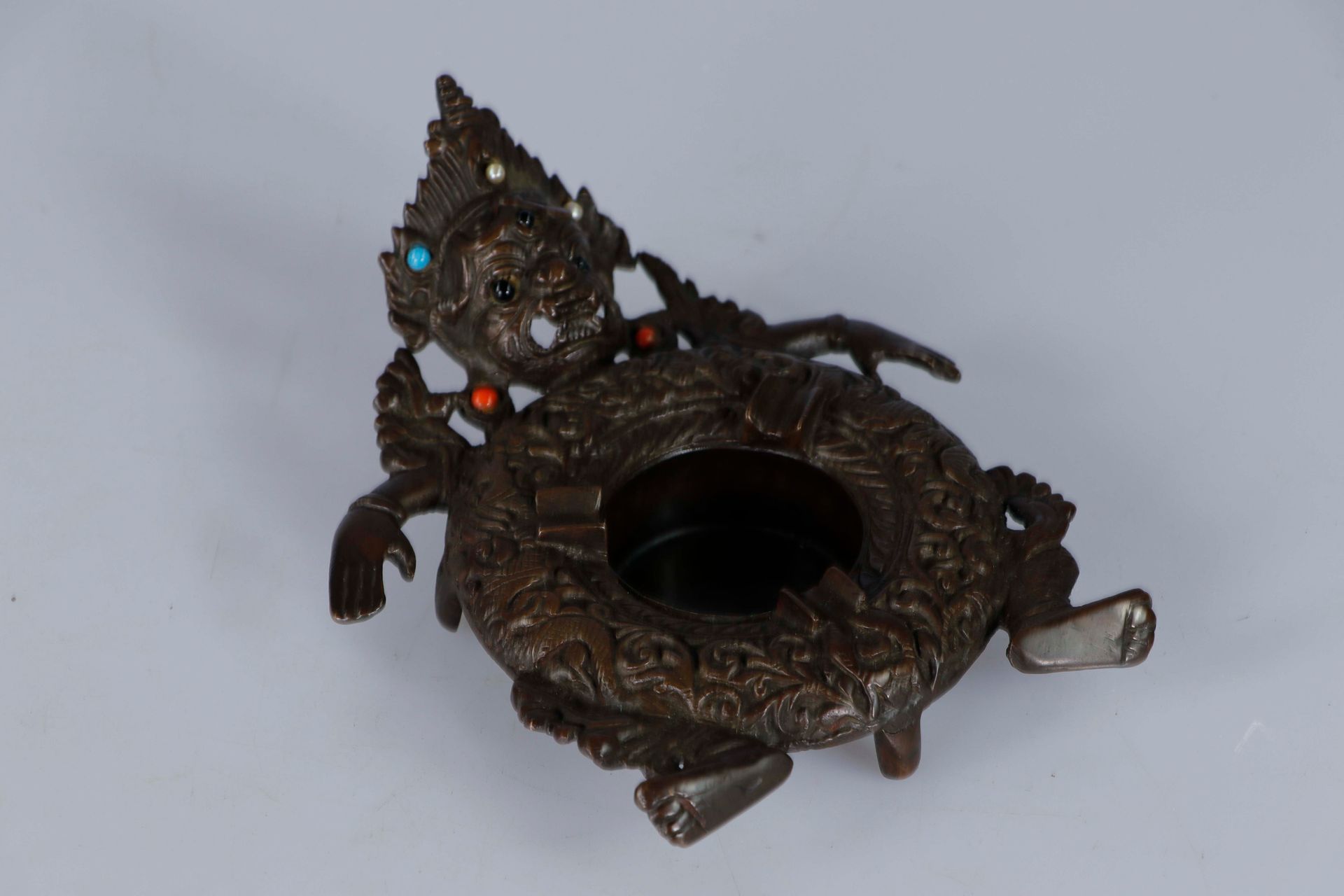Null TIBET, 20th century. Bronze ashtray in the form of a Mahakala figure. 19 x &hellip;