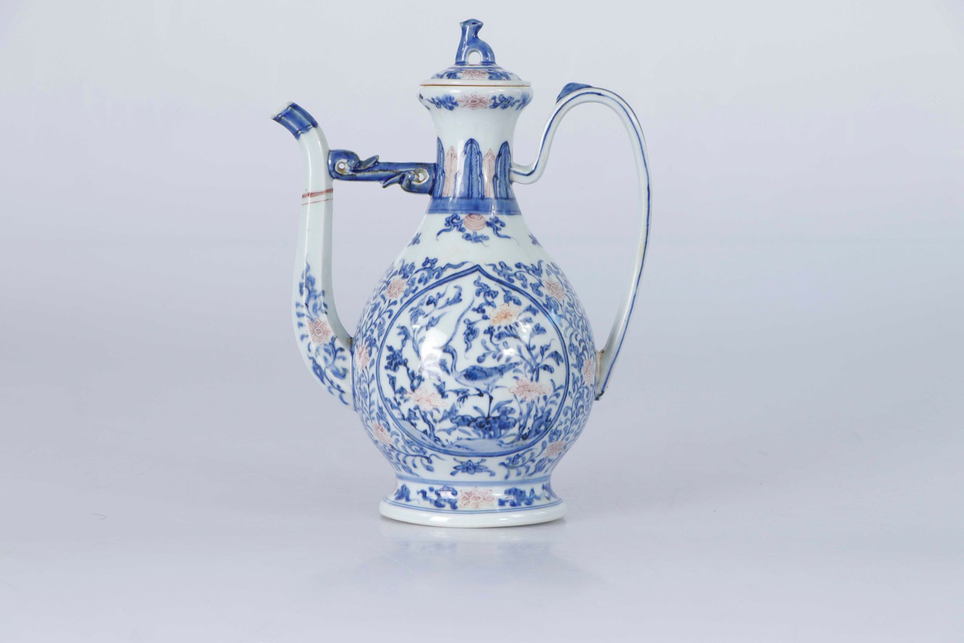 Null CHINA, 18th century. Porcelain ewer. Of Islamic influence, mounted on a foo&hellip;