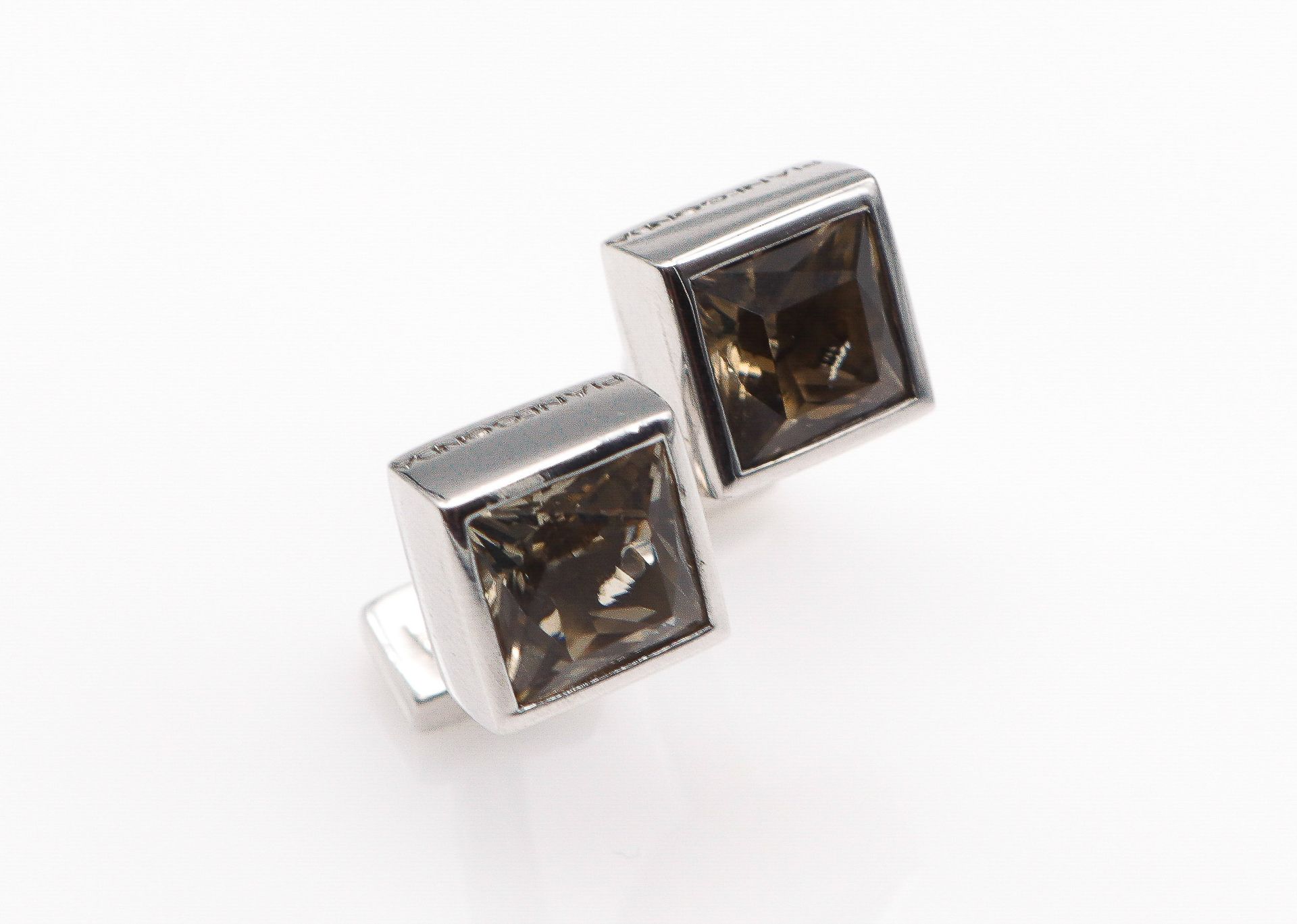 Null PIANEGONDA. Pair of silver cufflinks adorned with brown stones. Signed.