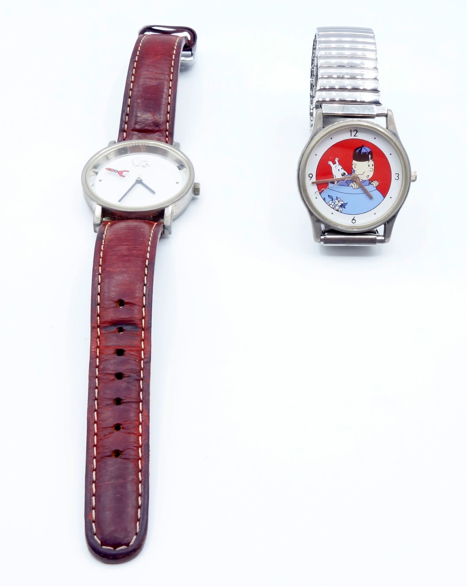 DIVERS 
Set of 3 watches, 2 Tintin (Citime) and 1 Le Chat. Very good condition.